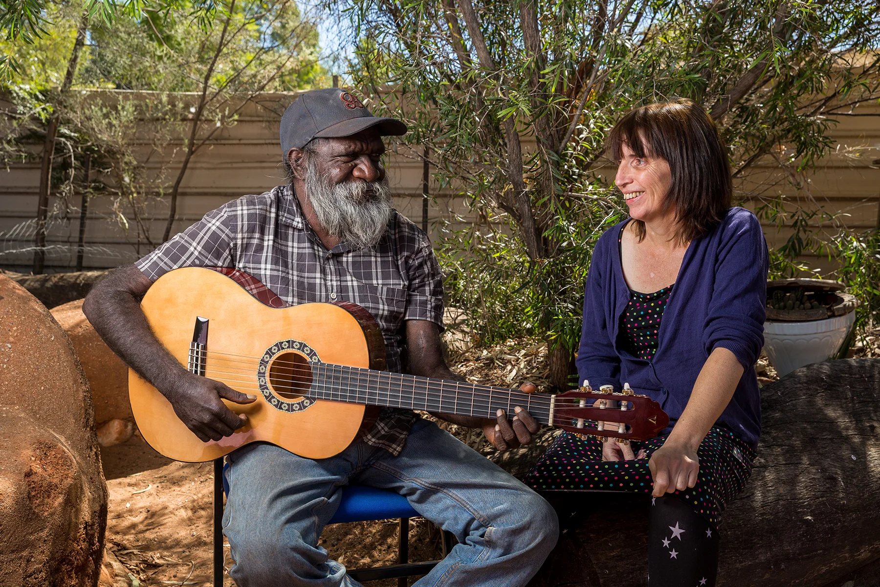 Sarah with dialysis patient Quentin Walker Jurrah in the backyard of the Purple House in Alice Springs