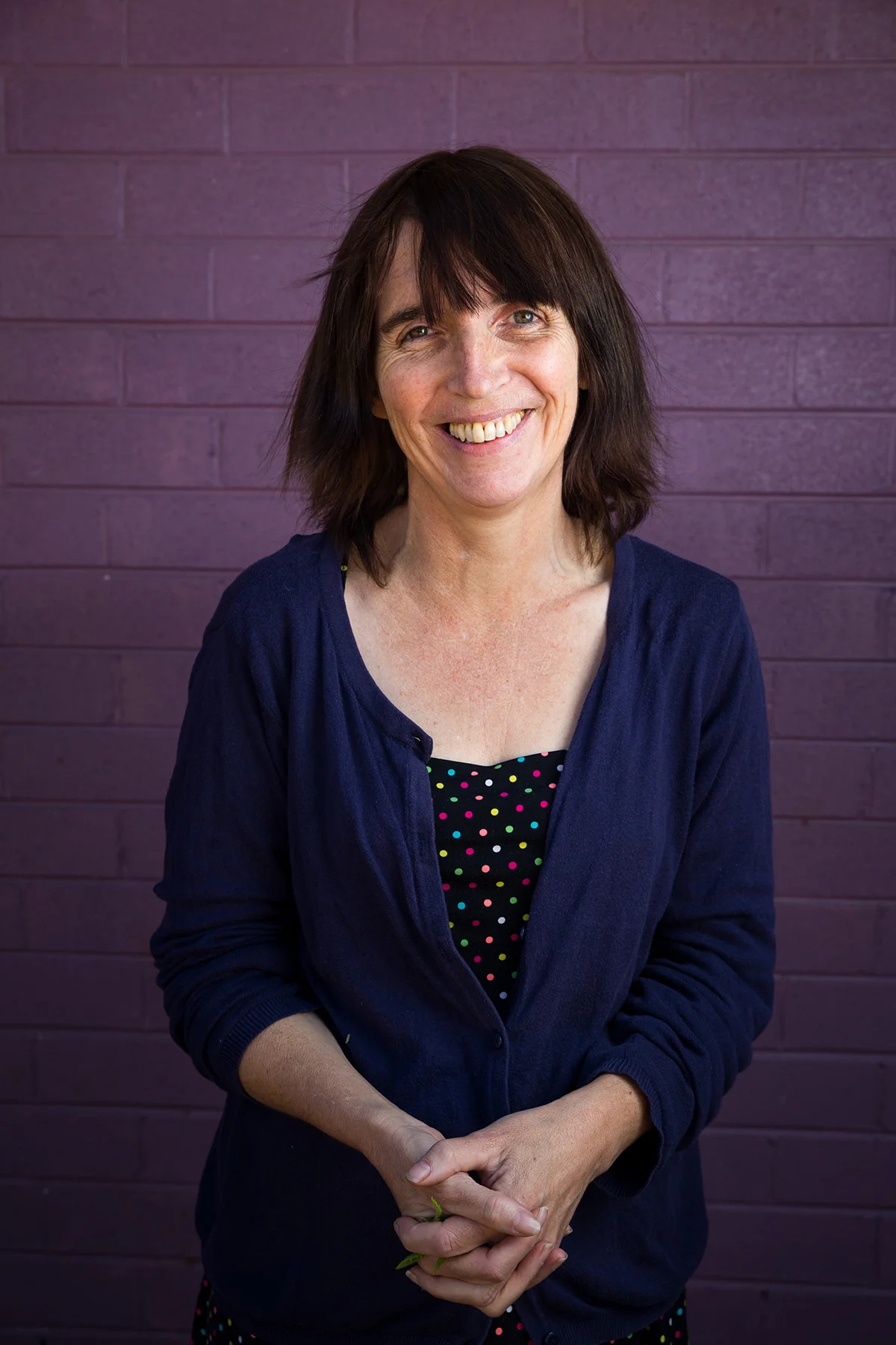 Sarah Brown in front of the purple walls of Western Desert Dialysis in Alice Springs