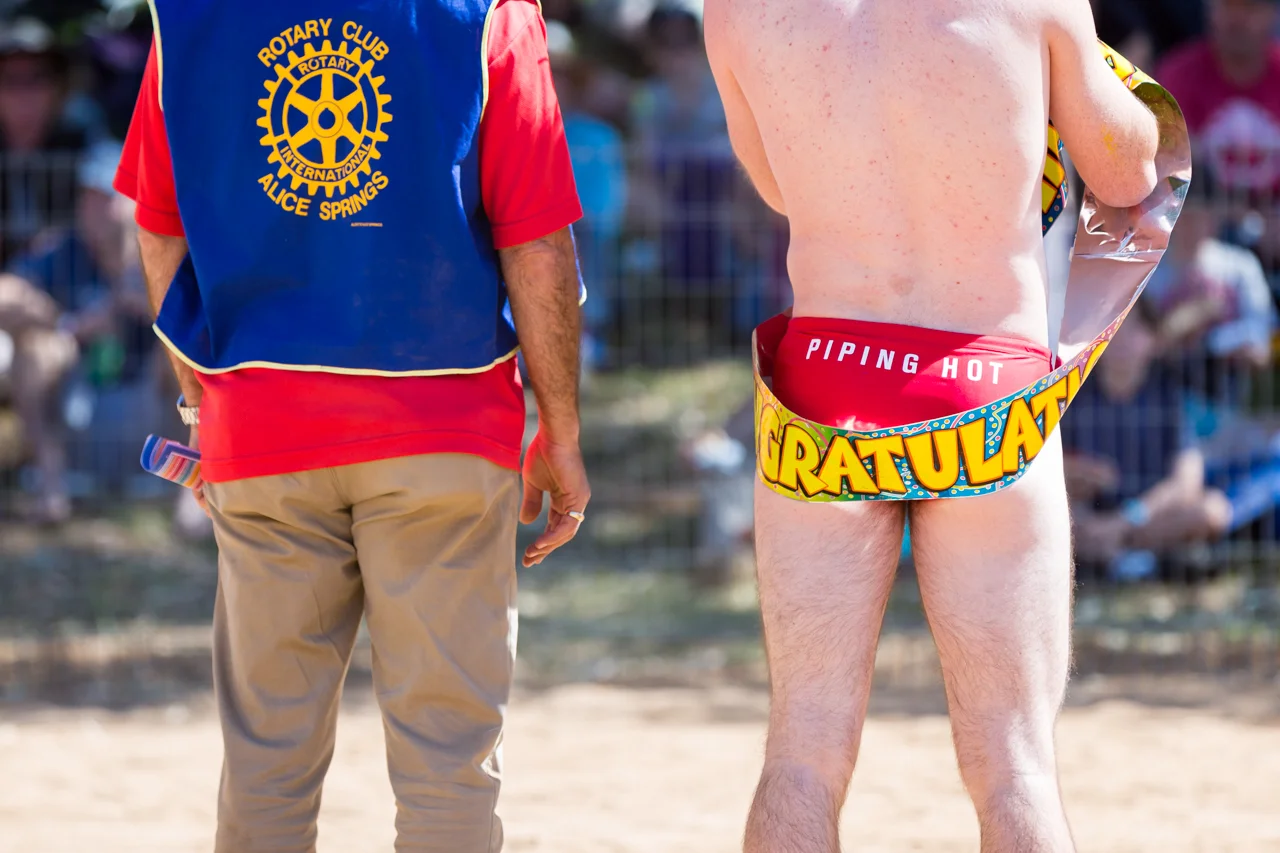 A competitor waits for the highly anticipated budgie smuggler race in the dry sand of the Todd River