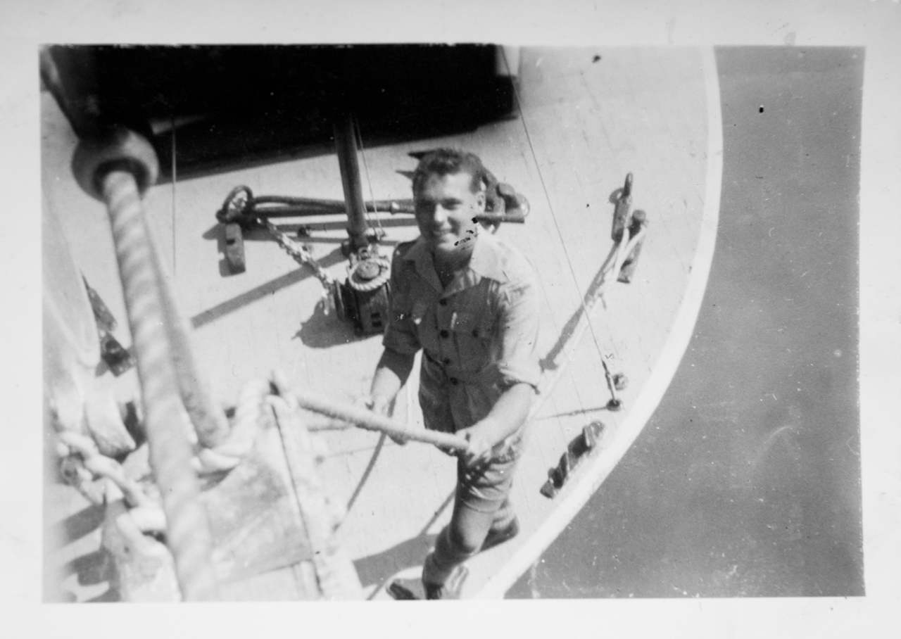 Ted's brother, Ray, in a boat tied to the Mooltan in the Suez Canal