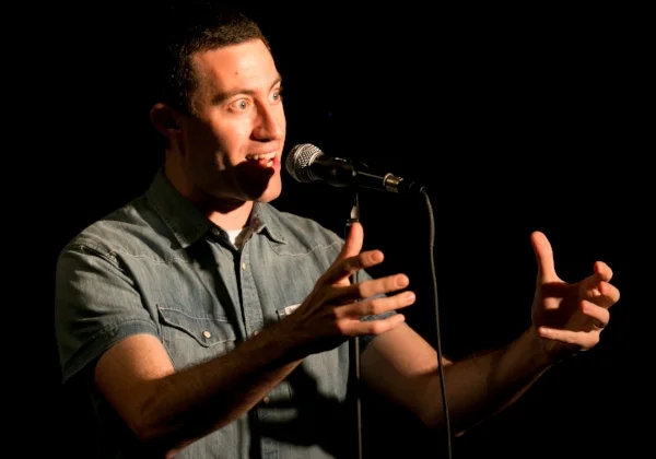 Adam Ruben tells his story at Busboys and Poets in Washington, DC. Photo by Michael Bonfigli.