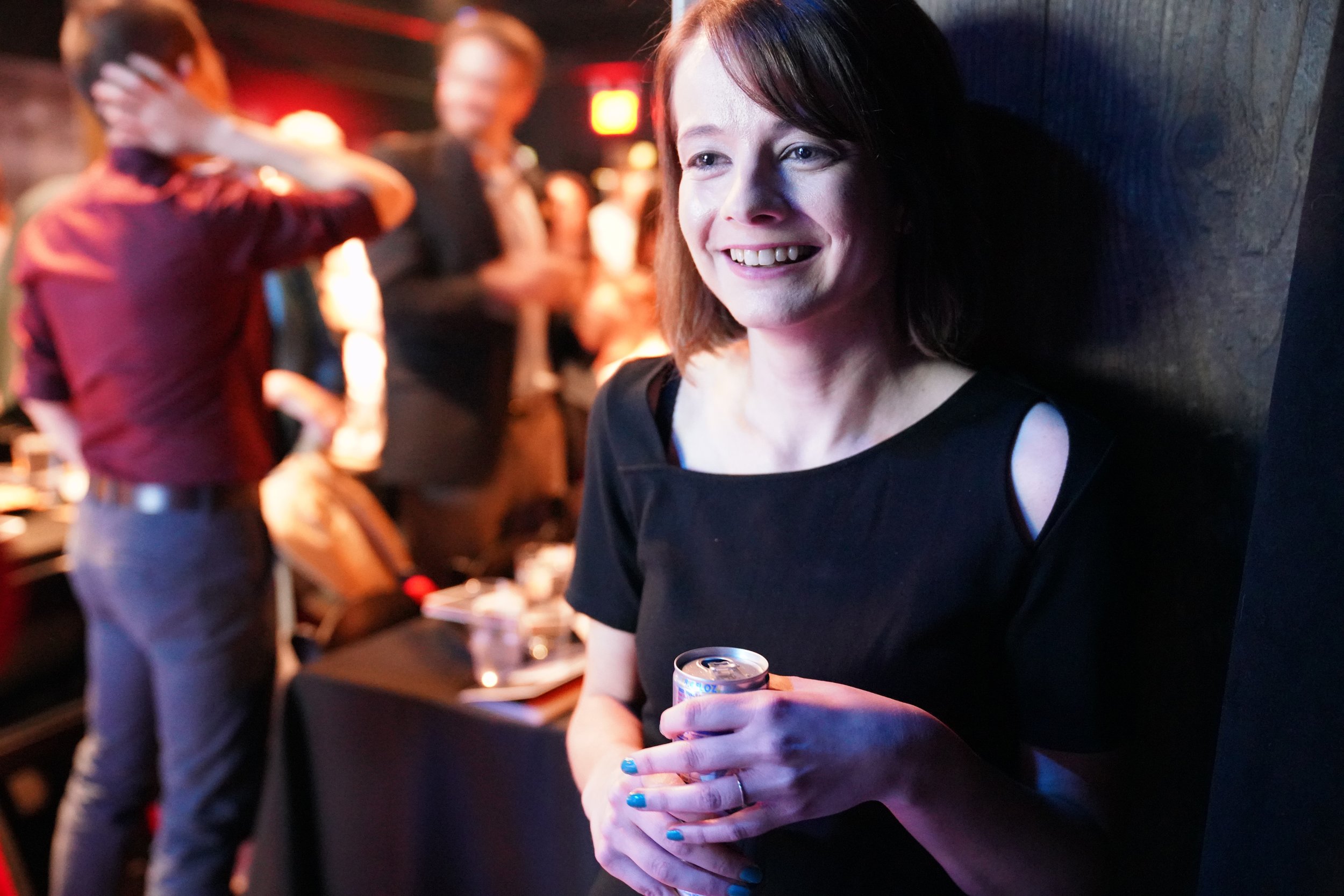  Story Collider artistic director Erin Barker savors her signature Red Bull while preparing to go on for the second half.  