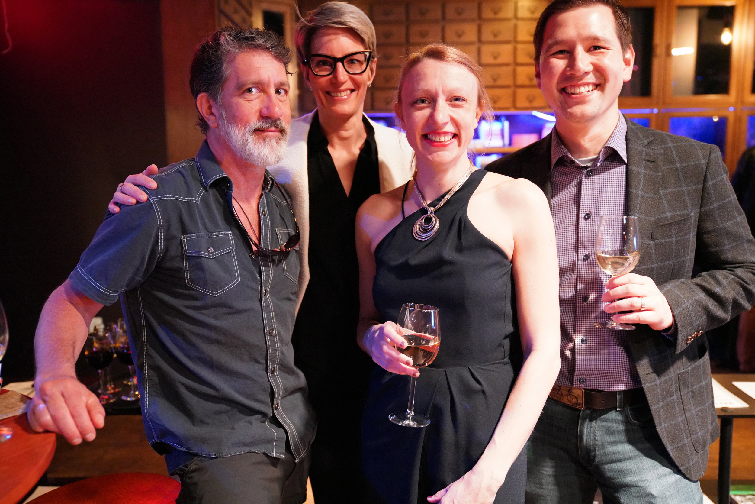  Story Collider producer Paula Croxson (second from right) and engineer Eric Jankowski (right) mingle with guests. 