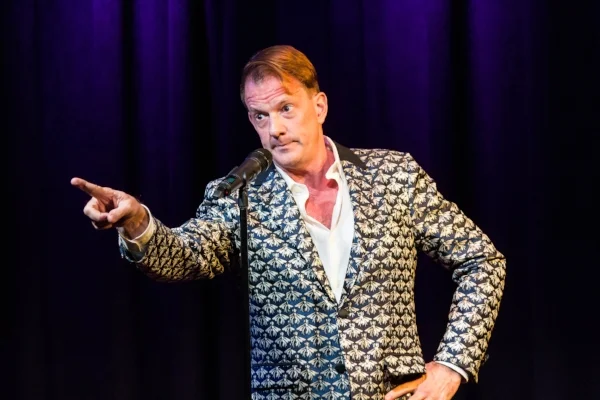 Jamie Brickhouse tells his story at Caveat in New York City In December 2017. Photo by Nicholas Santasier.