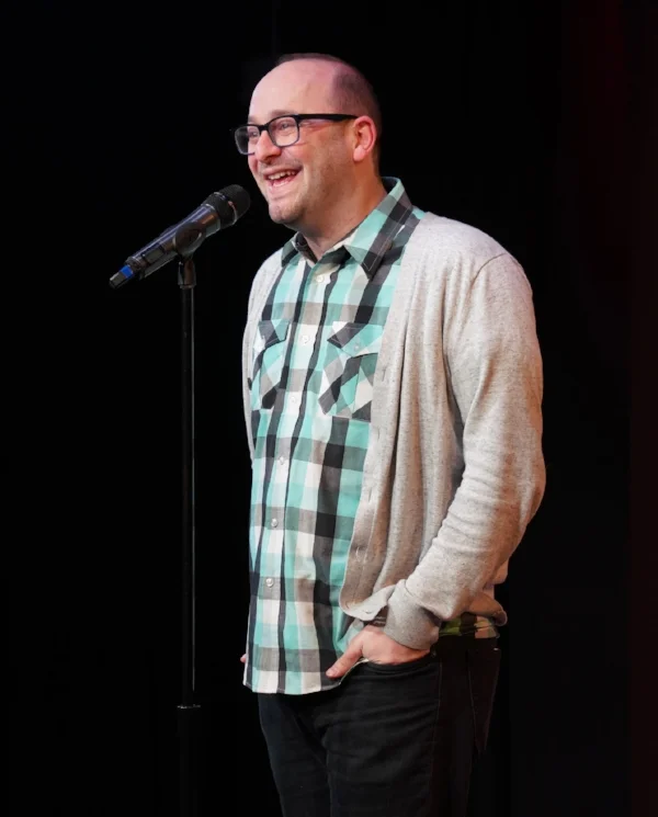 Josh Gondelman tells his story at our first-ever fundraiser, at Caveat in New York. Photo by Carly Hoogendyk.