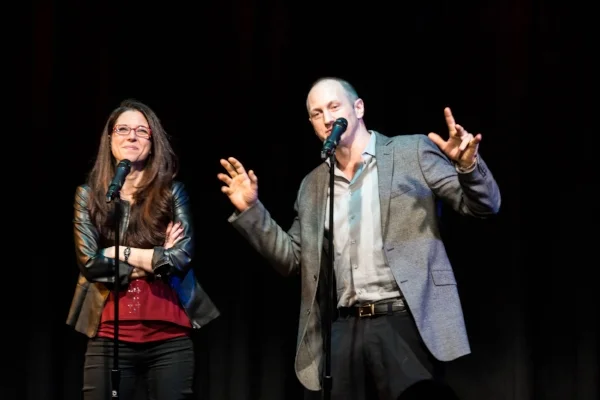 Heather Berlin and Baba Brinkman tell their story at Caveat in New York. Photo by Nicholas Santasier.