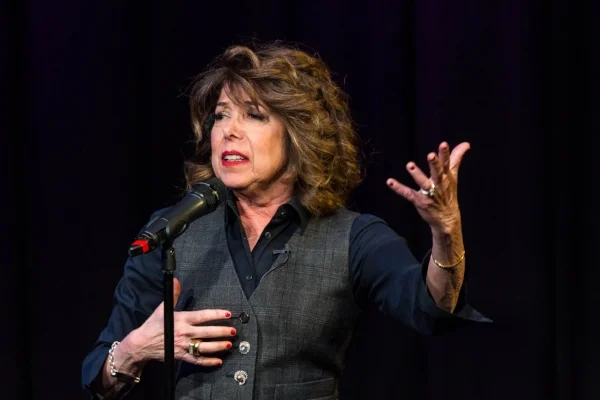 Sandi Marx tells her story at Caveat in New York City in March 2018. Photo by Nicholas Santasier.