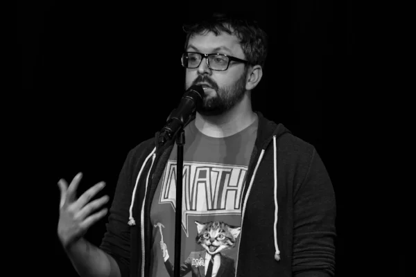 Math for America Master Teacher Matt Baker shares his story at our April 2018 show with Math for America at Caveat in New York. Photo by Nicholas Santasier.