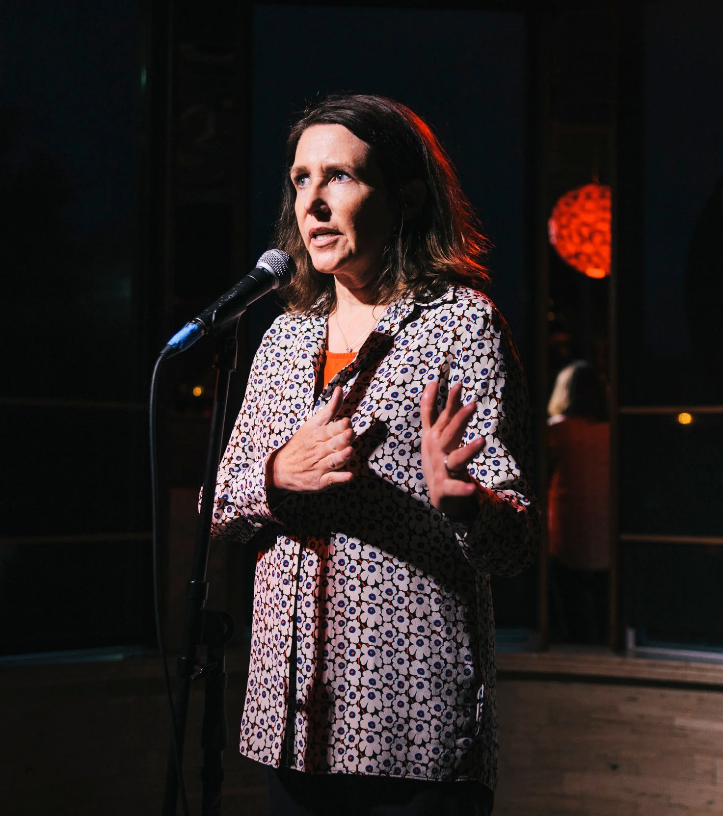Michelle McCrackin shares her story at our show in partnership with ASLO in June 2018. Photo by Linus Wong.