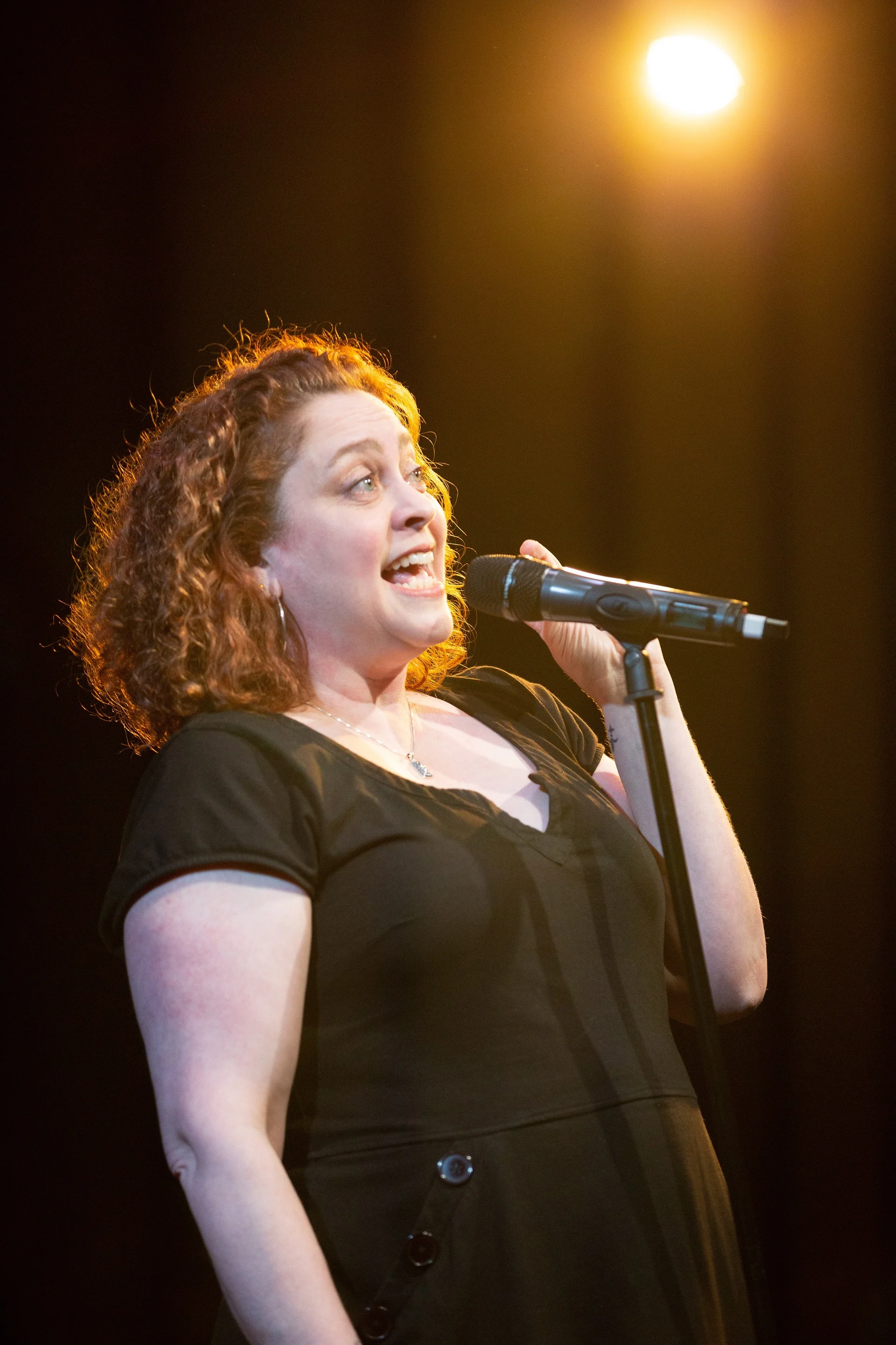 Edith Gonzalez shares her story on the Story Collider stage at Caveat in NYC in February 2019. Photo by Zhen Qin.
