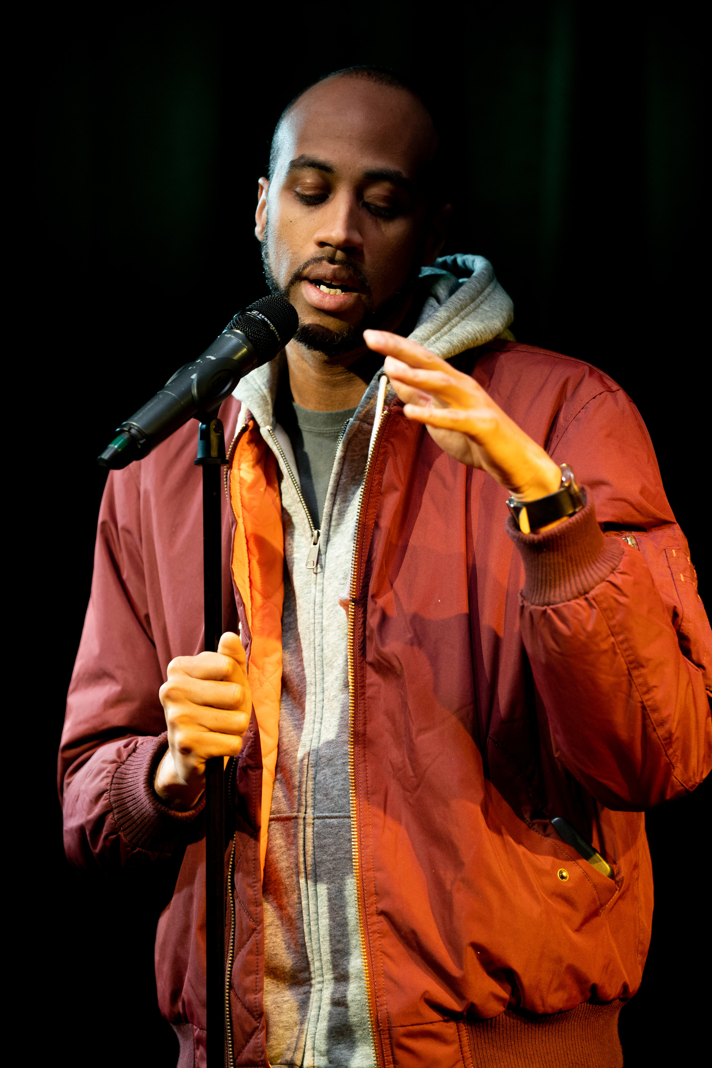 Mike Brown shares his story with The Story Collider at Caveat in NYC in February 2019. Photo by Zhen Qin.