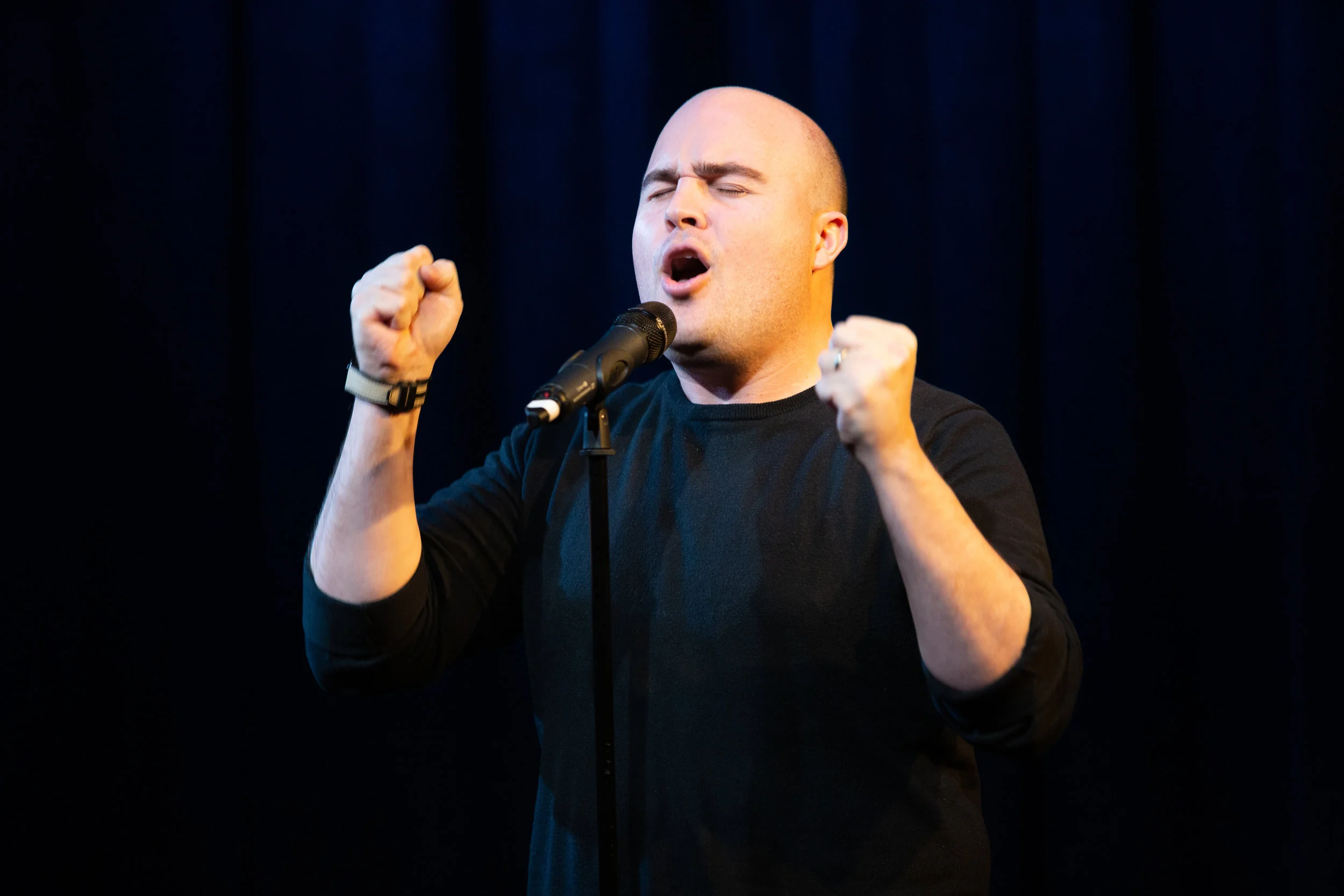 Zack Stovall shares his story with the Story Collider audience at Caveat in New York City in February of 2019. Photo by Arin Sang-Urai.