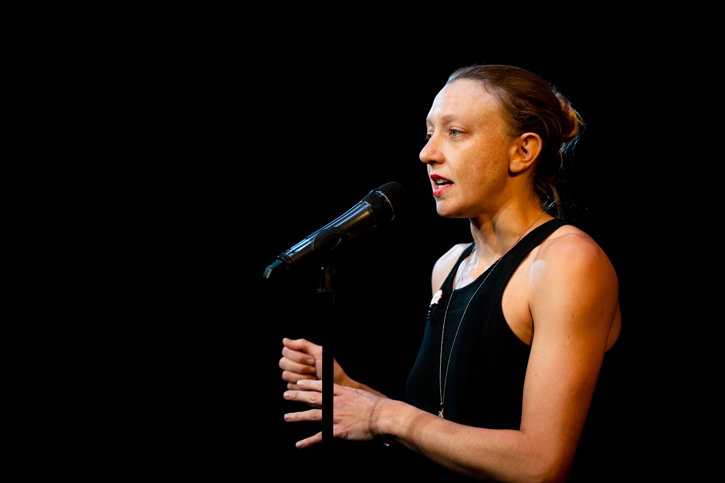 Paula Croxson shares her story with the Story Collider audience at Caveat in New York City in October 2018. Photo by Zhen Qin.