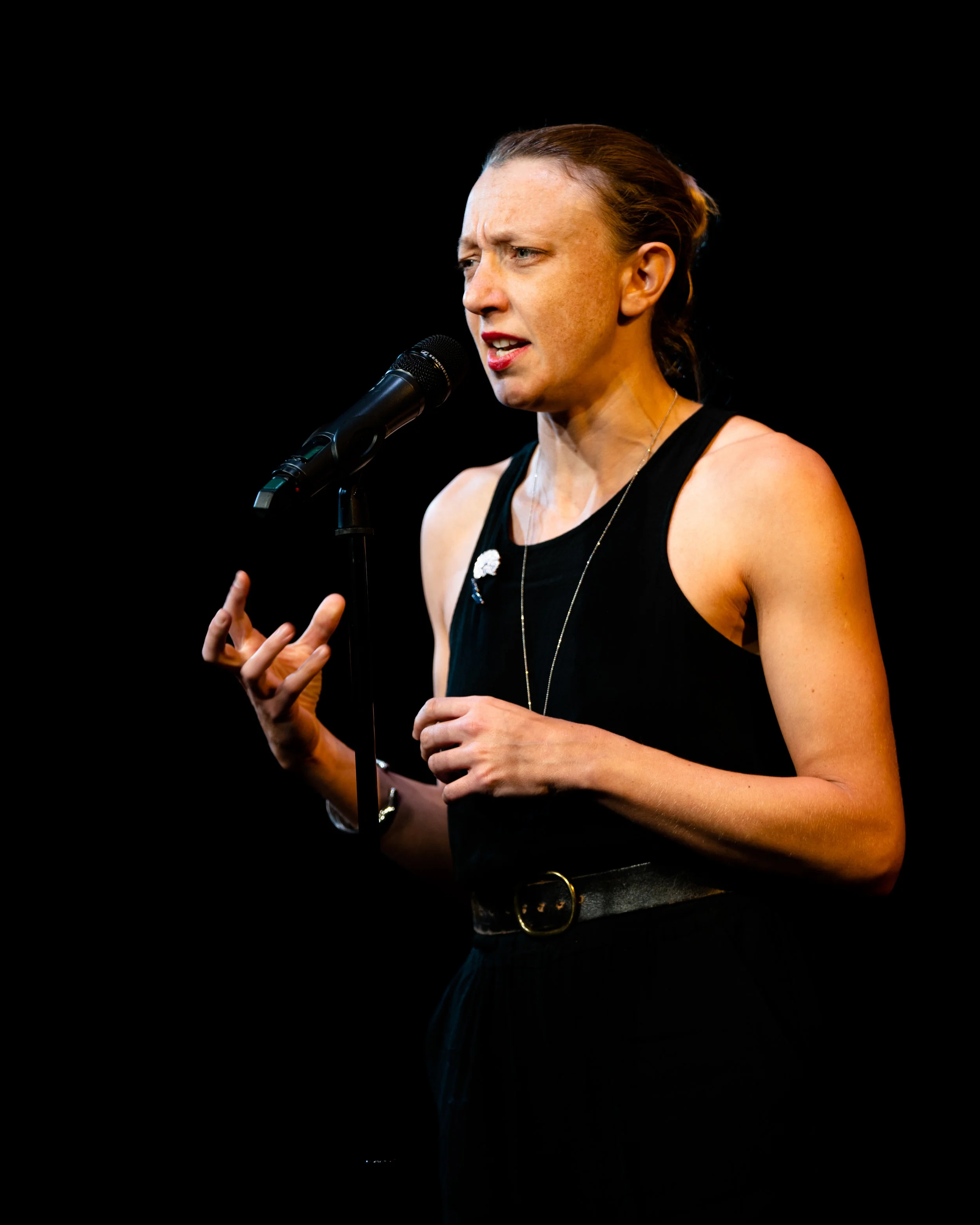 Paula Croxson shares her story with the Story Collider audience at Caveat in New York City in October 2018. Photo by Zhen Qin.