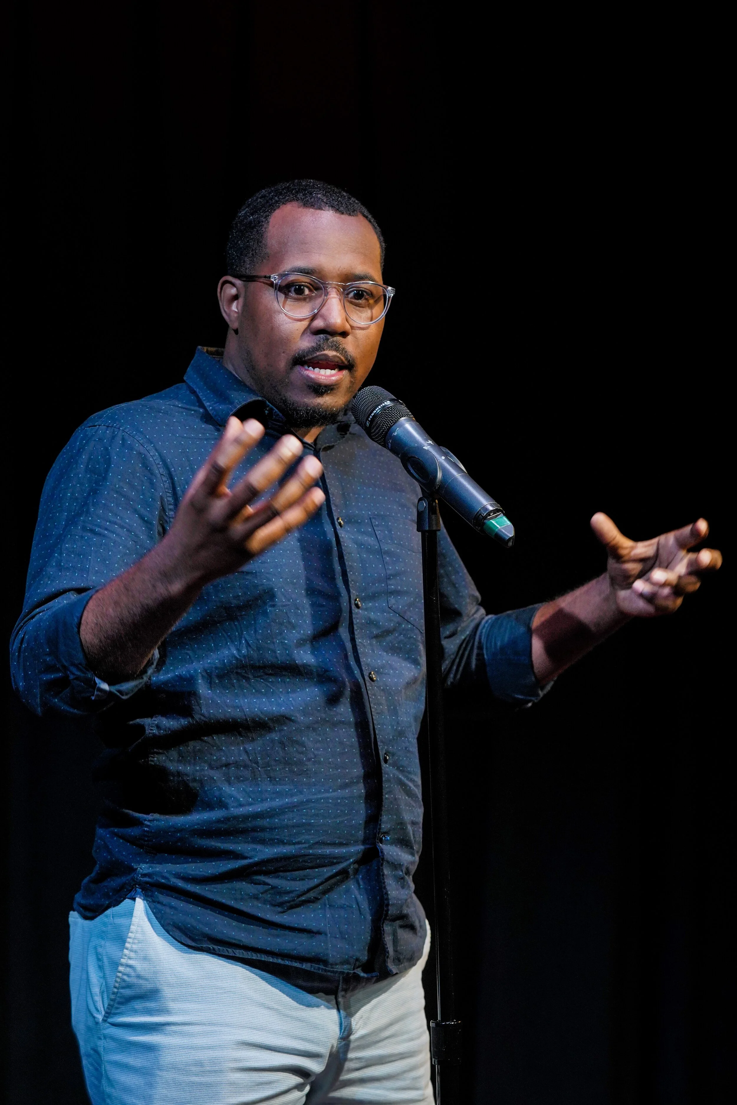 Alvin Irby shares his story with the Story Collider audience at Caveat in New York City in July 2019. Photo by Zhen Qin.