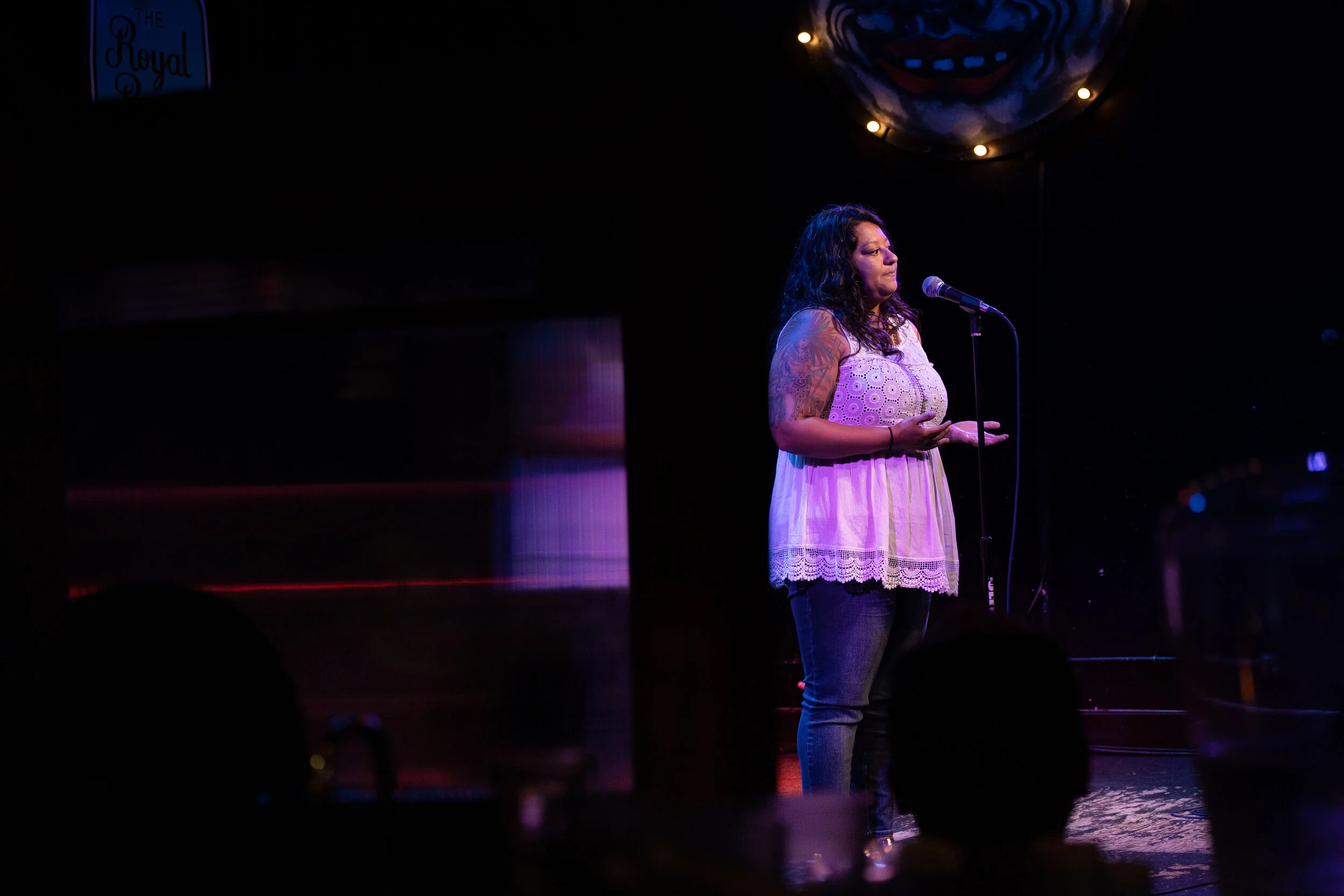 Lylliana Allala shares her story with the Story Collider audience in the Royal Room in Seattle, WA in June 2019. Photo by Elizar Mercado.