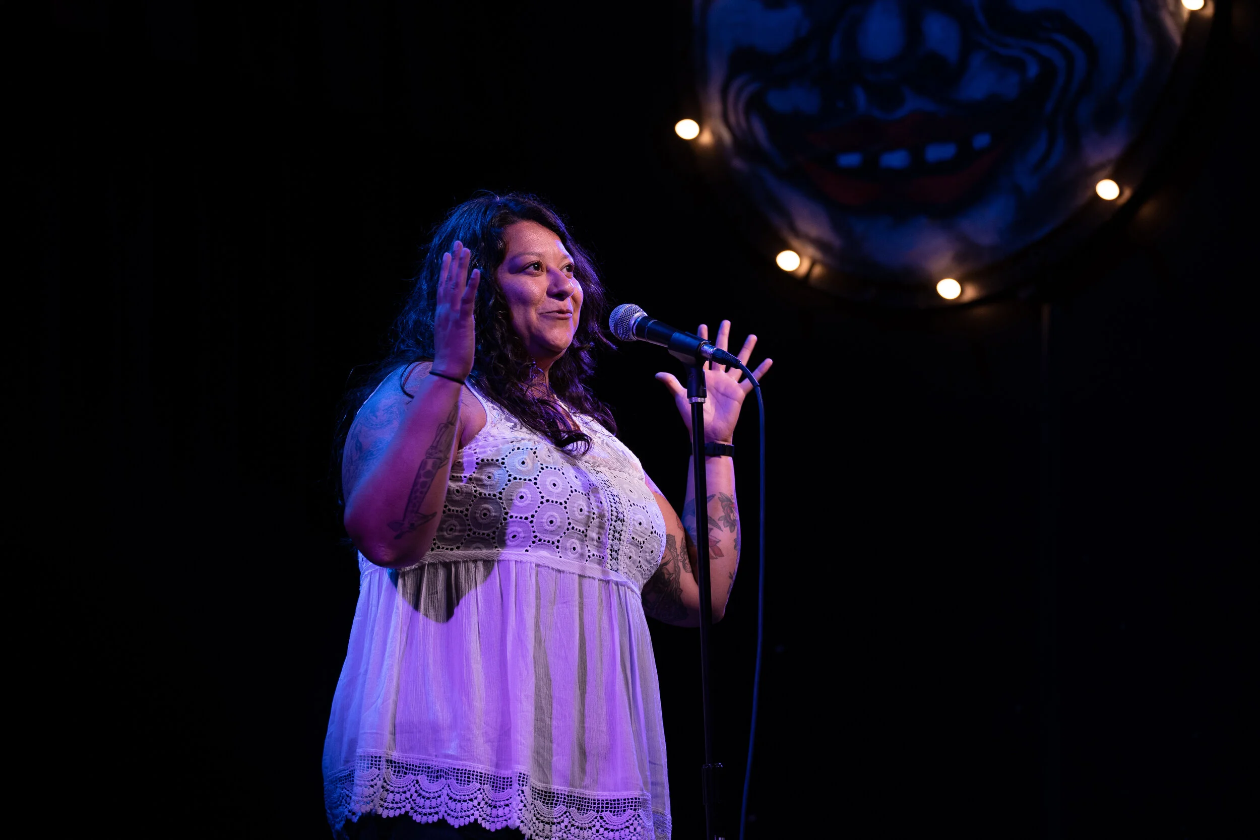 Lylliana Allala shares her story with the Story Collider audience in the Royal Room in Seattle, WA in June 2019. Photo by Elizar Mercado.