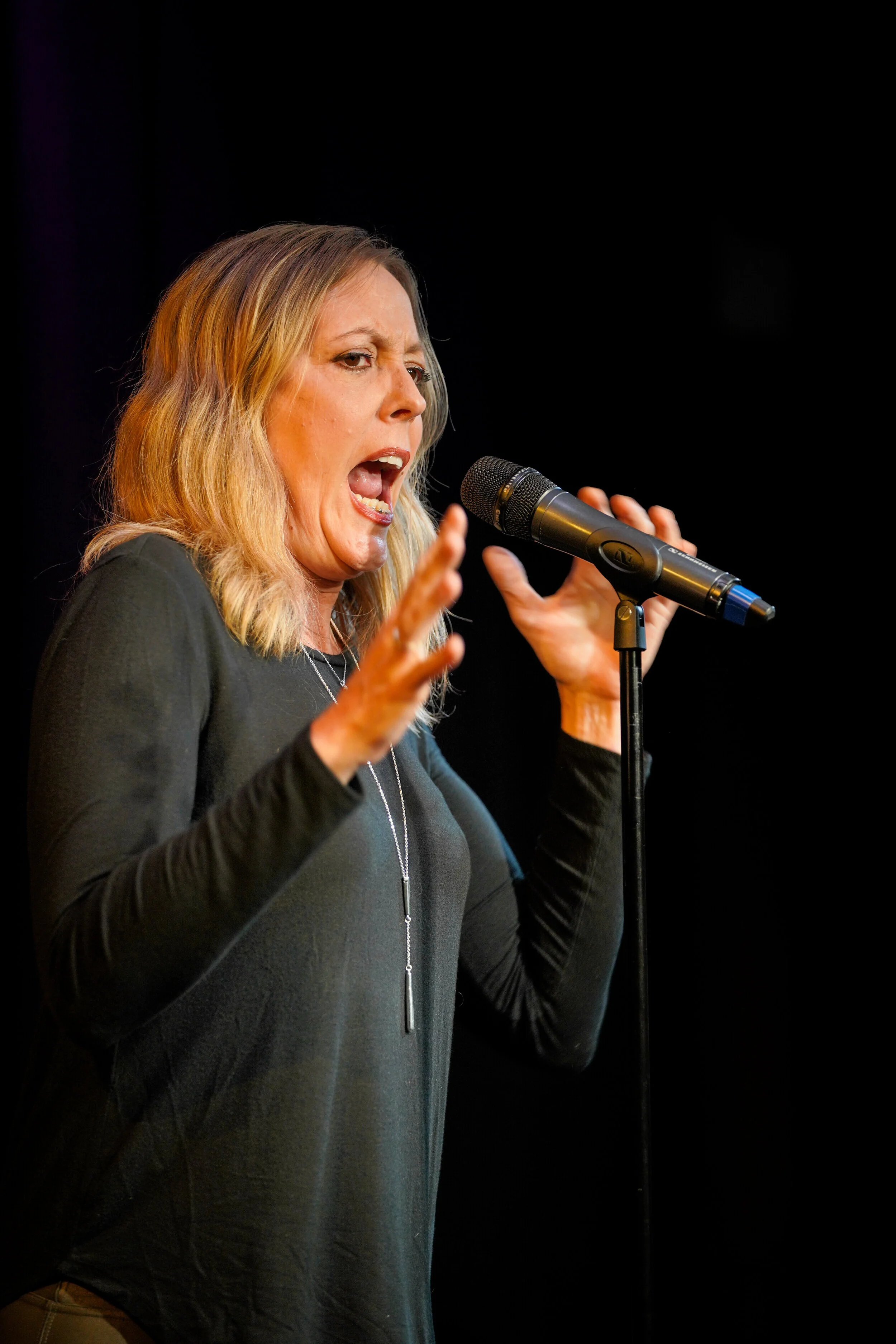 Kambri Crews shares her story with the Story Collider audience at Caveat in New York City in September 2019. Photo by Zhen Qin.