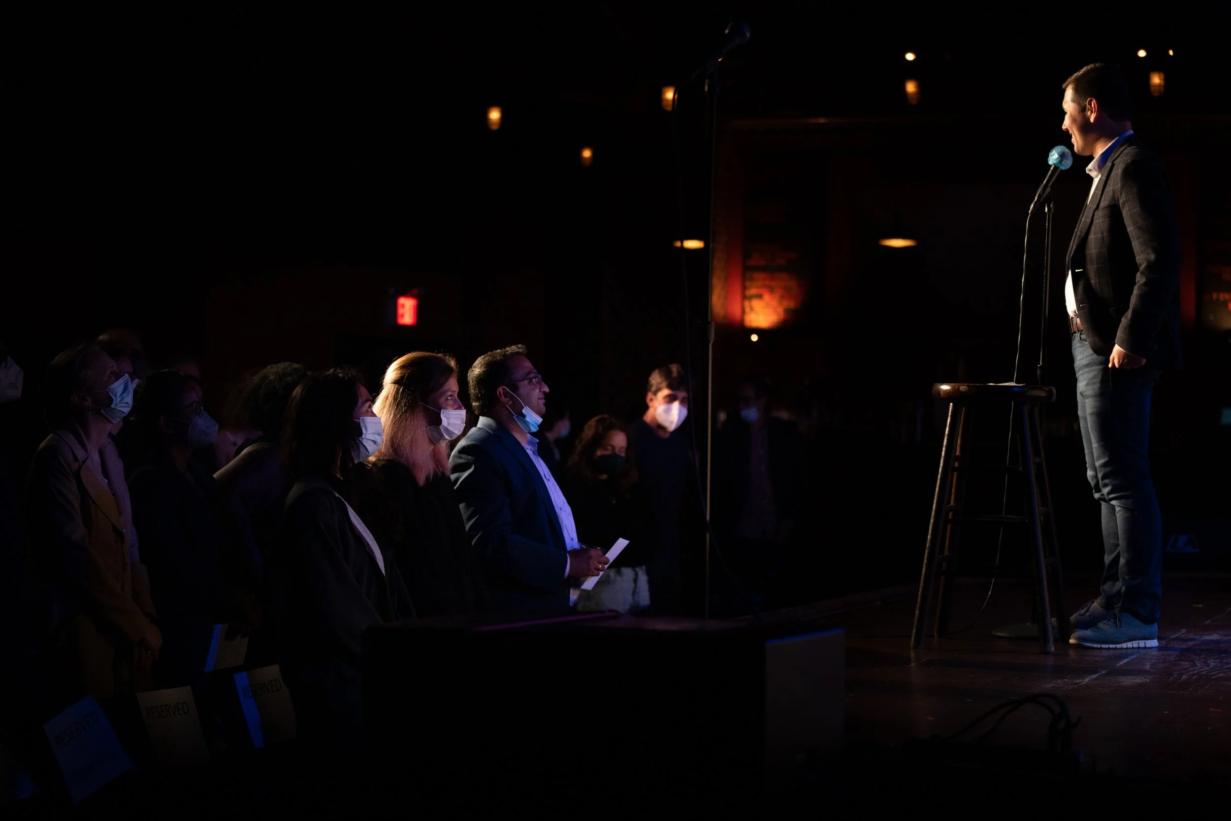 The audience watches Eric Jankowski share his story at The Bell House in Brooklyn, NY.