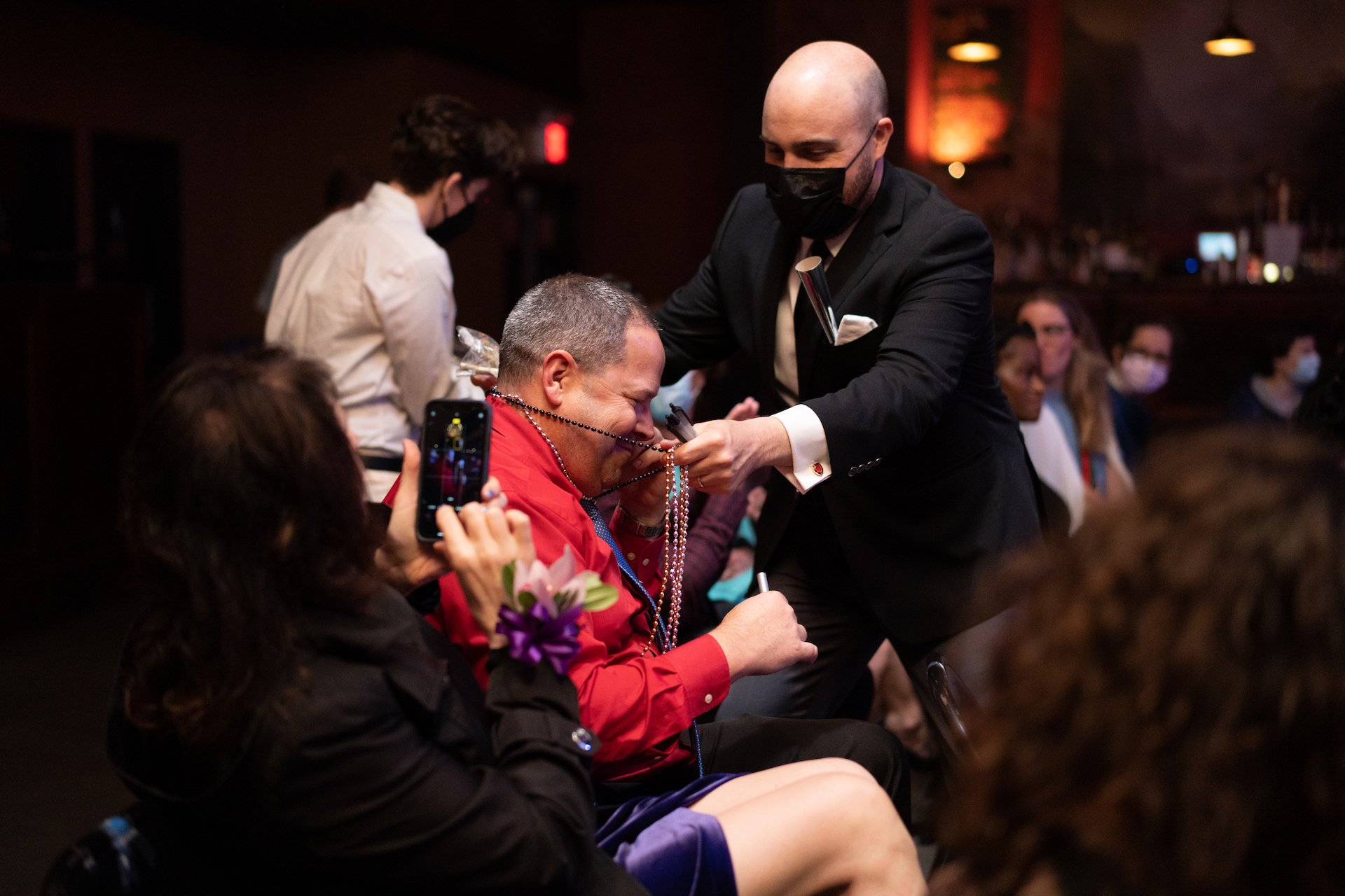  New York producer Zack Stovall places beads on a donor.  