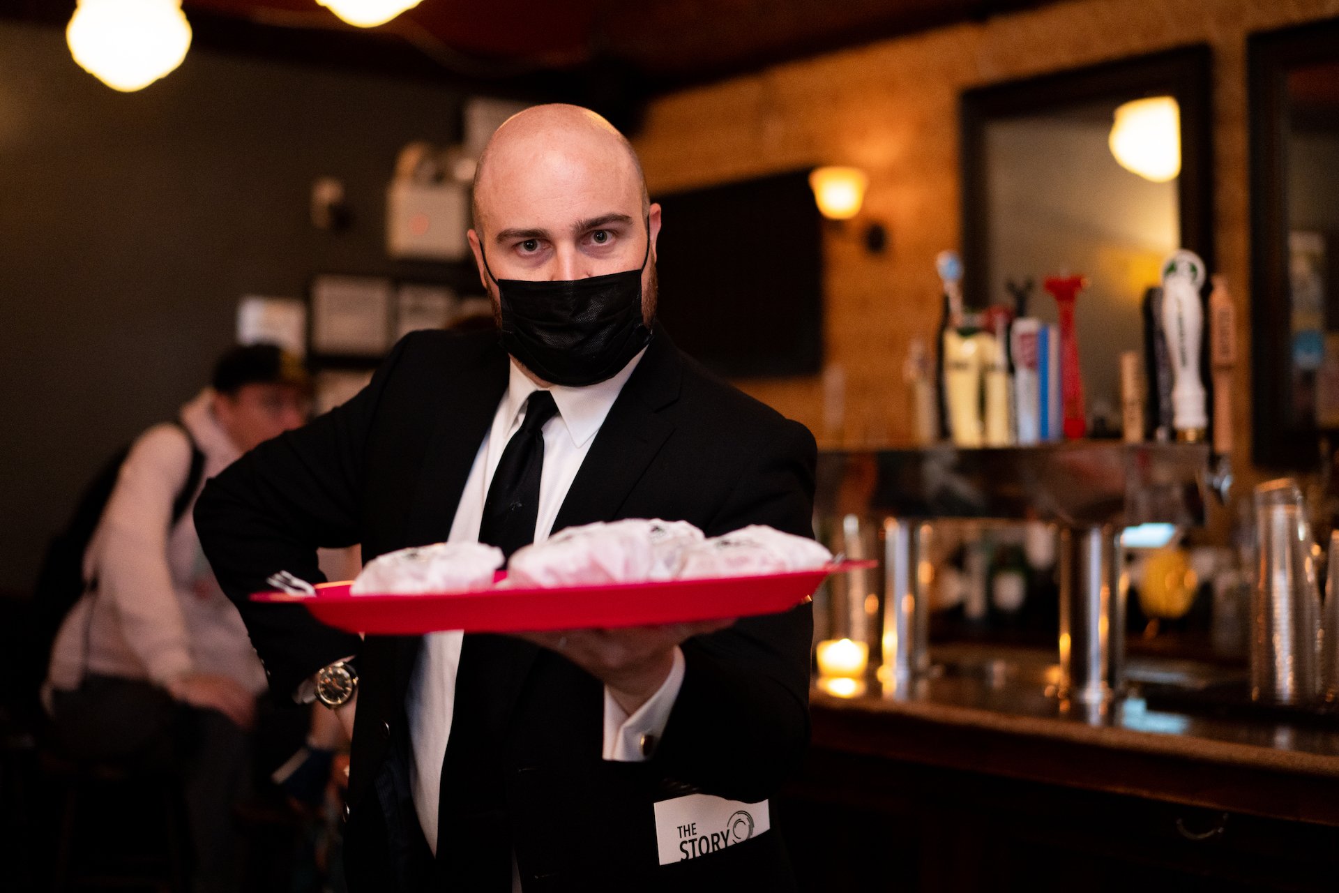  New York producer Zack Stovall holding a tray of ice cream sandwiches at Proton Prom.  