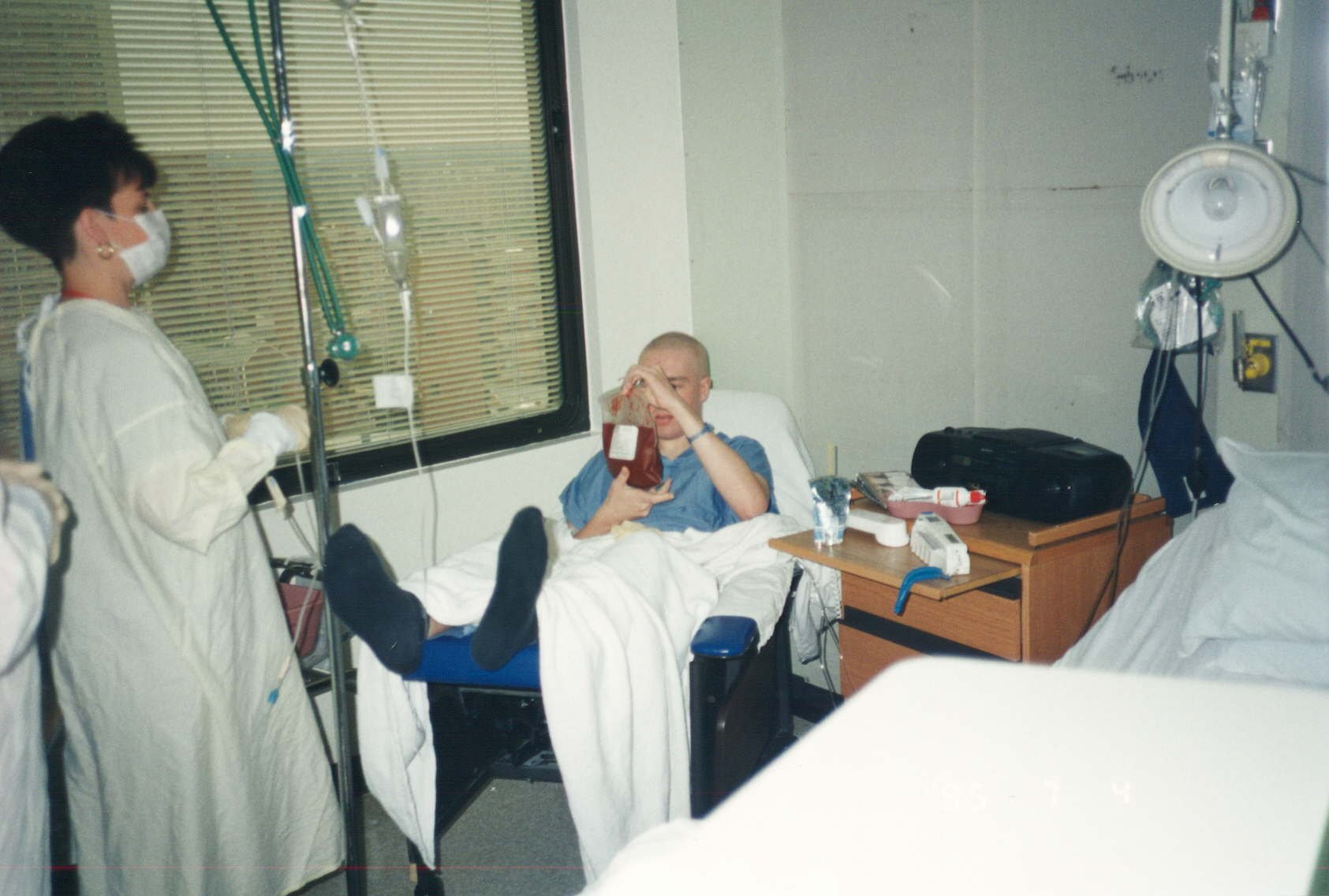  The day of Brendan’s bone marrow transplant.   “I had made it through a week of intense radiation and am holding an infusion bag holding the almost 1 liter of bone marrow donated by my brother.”- Brendan Harley 