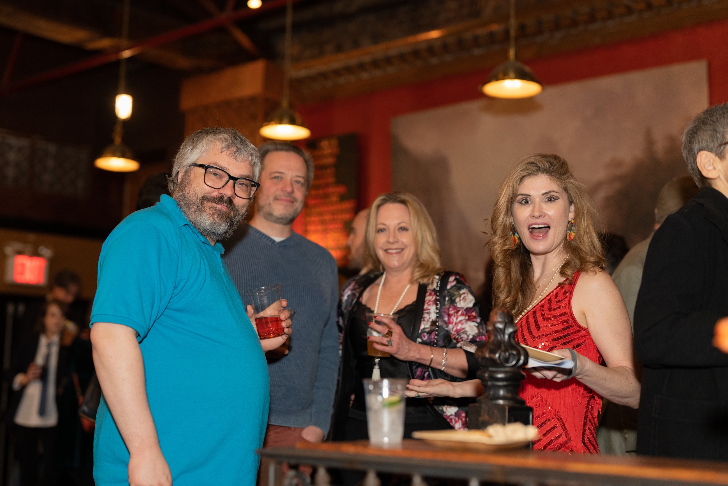  The Story Collider co-founder Ben Lillie (left) and host Natalia Reagan (right) with Proton Prom guests.  