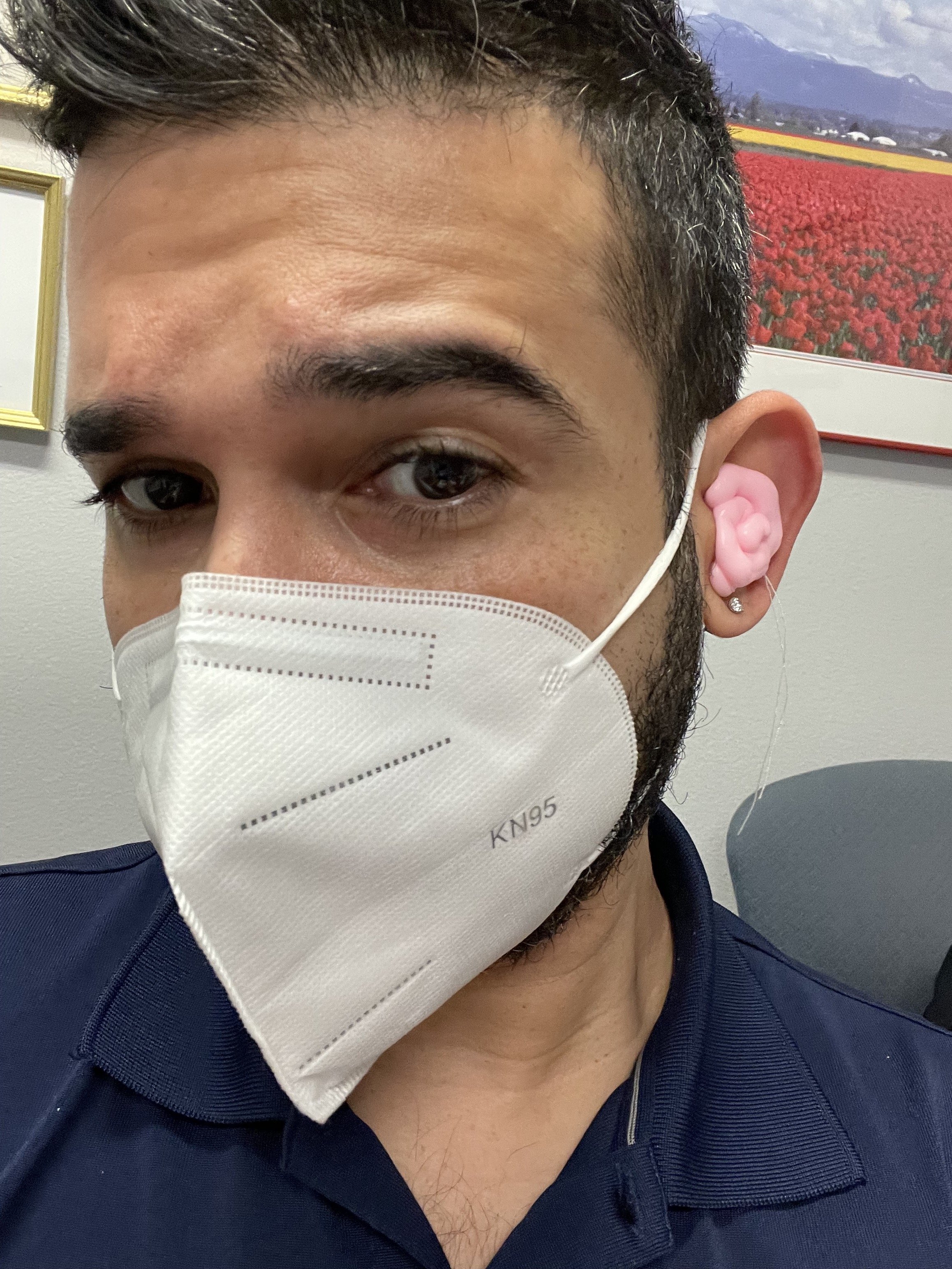  Javier at the audiologist getting molds made for a new pair of hearing aids, during the mid stages of the pandemic. They support streaming music via his phone’s Bluetooth capabilities. 