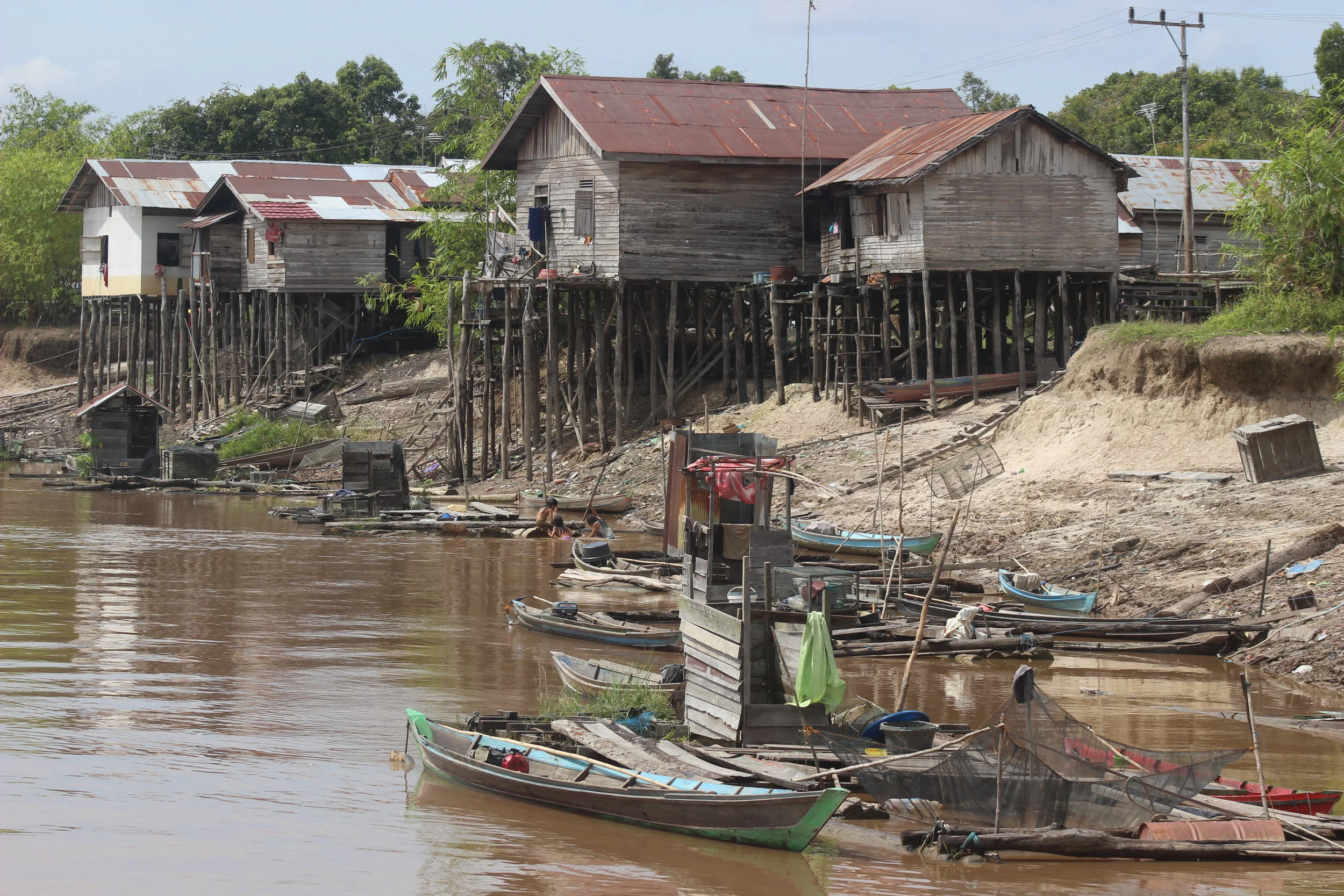 The Petuk Katimpun village is built on stilts to accommodate river tides. These houses are right on the water during the wet season.  