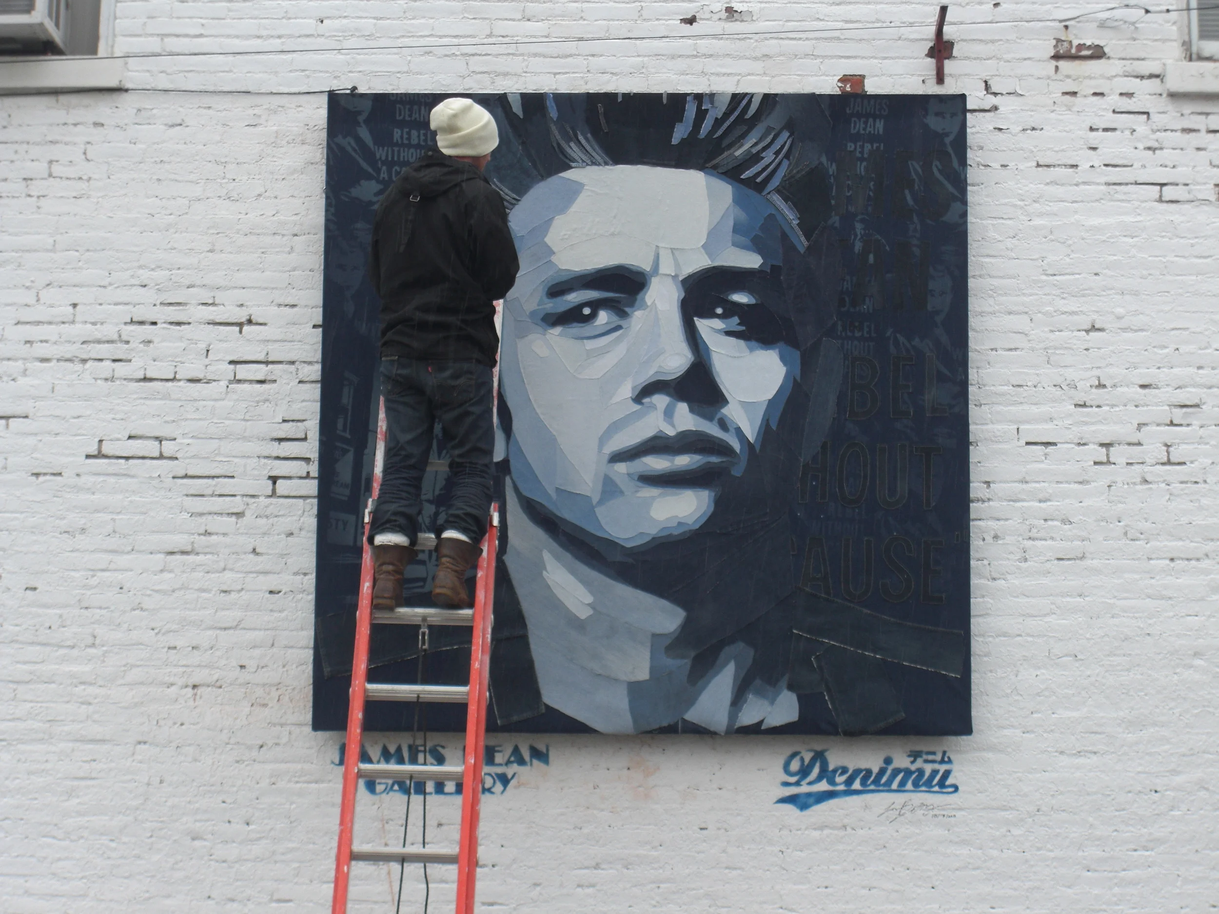  The large piece was based on a Roy Schatt photograph, with many images created in the background, including a picture of Dean walking right where the picture hangs now, by the town’s Citizens Exchange Bank. These details were bleached in, with stitc