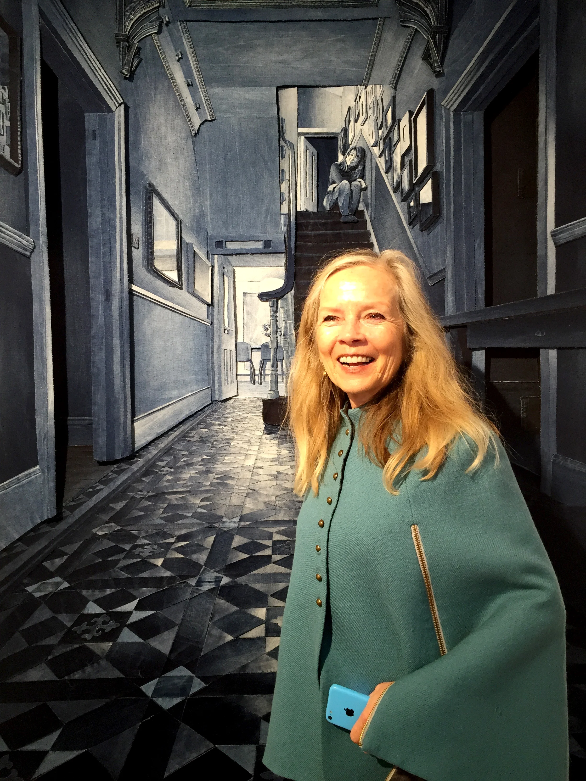 Jo Good with Ian Berry's piece Behind Closed Doors