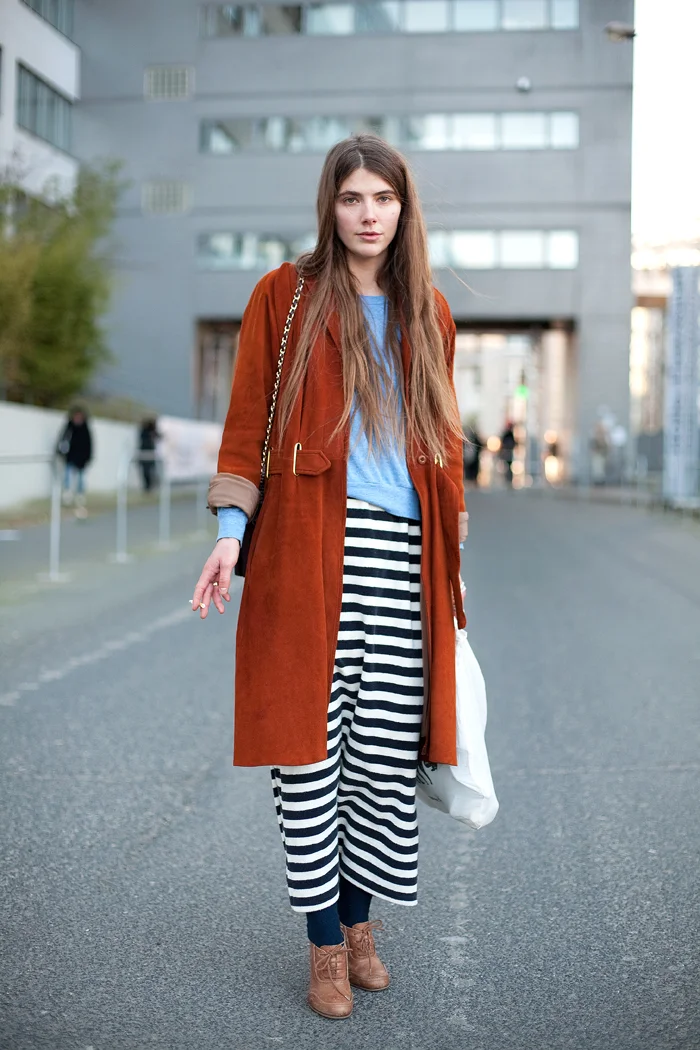 Got a girl crush on: Girl with the orange jacket and long striped skirt.
Been seeing this photo passed around the internet over the week or so, and I stop to stare at it every single time. I love the stark contrast of the orange with the striped long skirt. The light blue American Apparel tri-blend raglan is a nice touch, as are the navy blue socks. How can such an amorphous outfit look so good?!
(via darlingdays : fuckyeahstreetstyle : Mr. Newton )