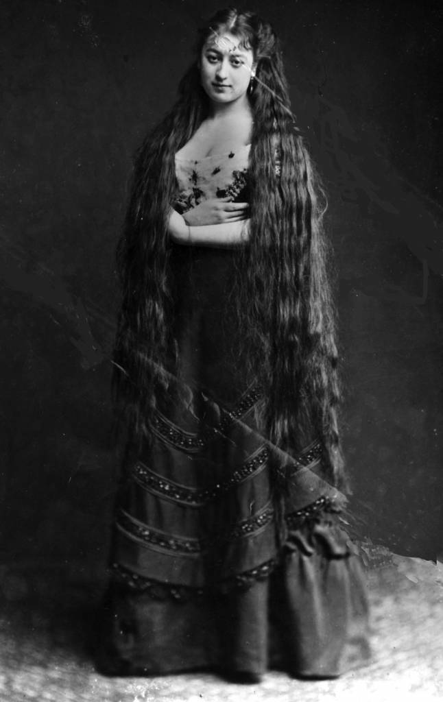 circa 1890: Mrs Frampton proudly displays her very long hair. (Photo by Hulton Archive/Getty Images)