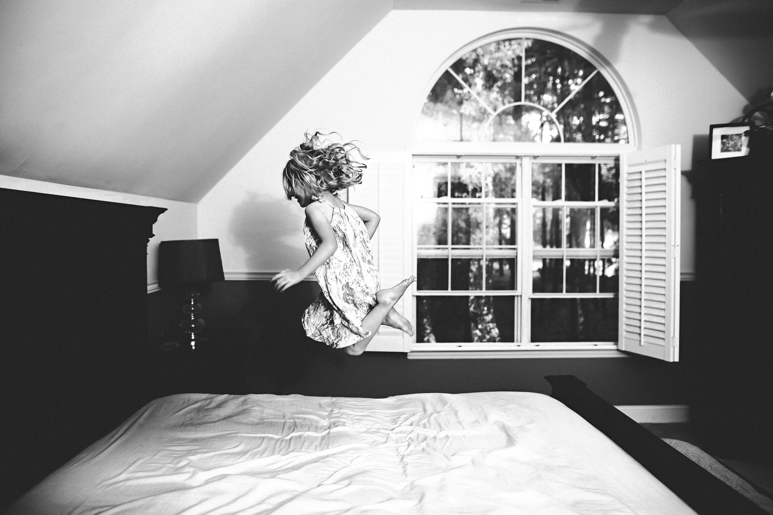 hello-olivia-photography-long-island-family-photographer-jumping-bed.jpg