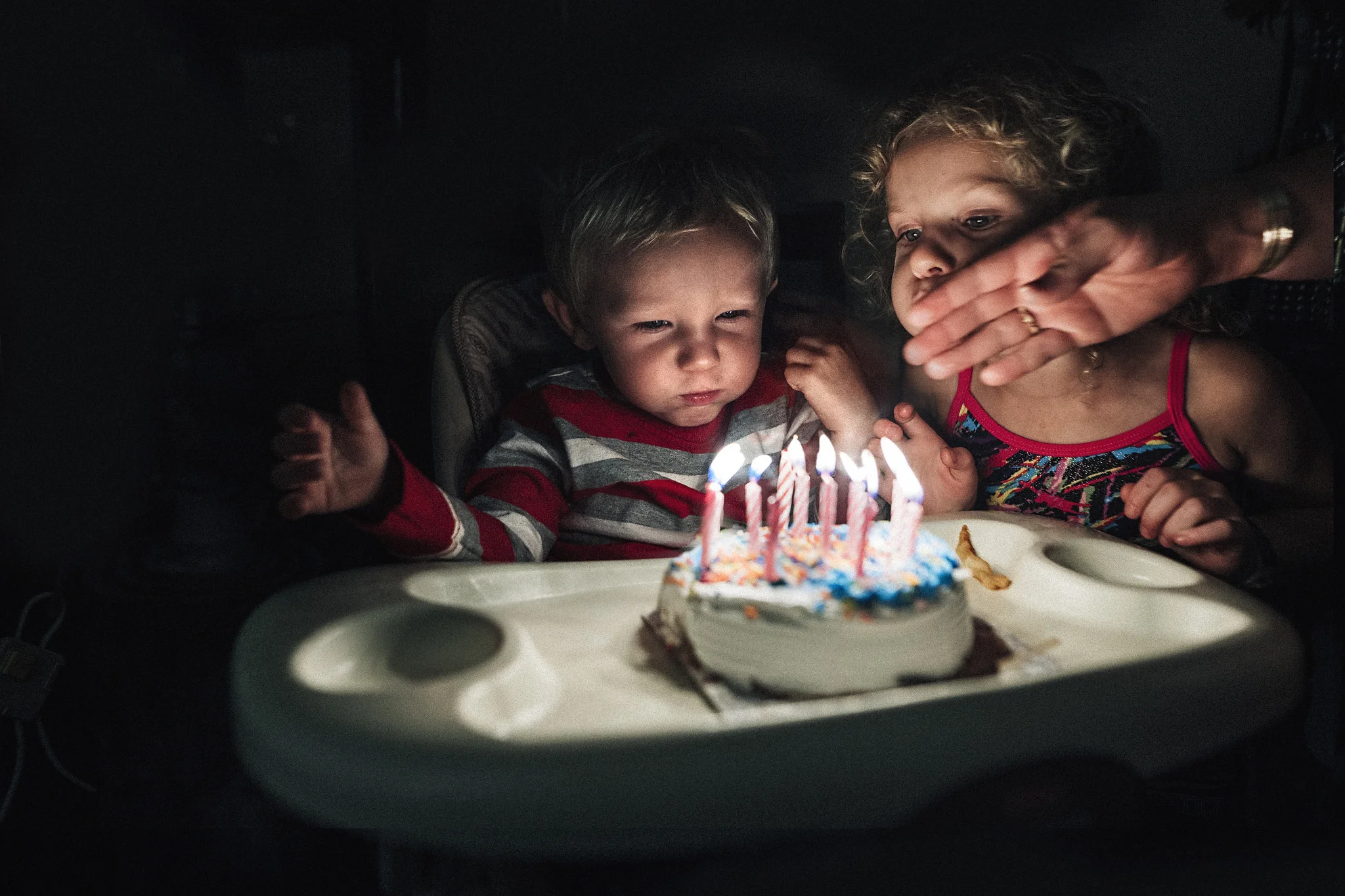 hello-olivia-photography-family-photojournalism-documentary-and lifestyle-photographer-long-island-new-york-blowing-candles-siblings.jpg