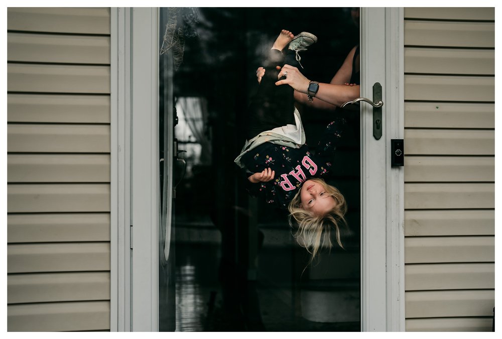 Long Island Girl upside down in door