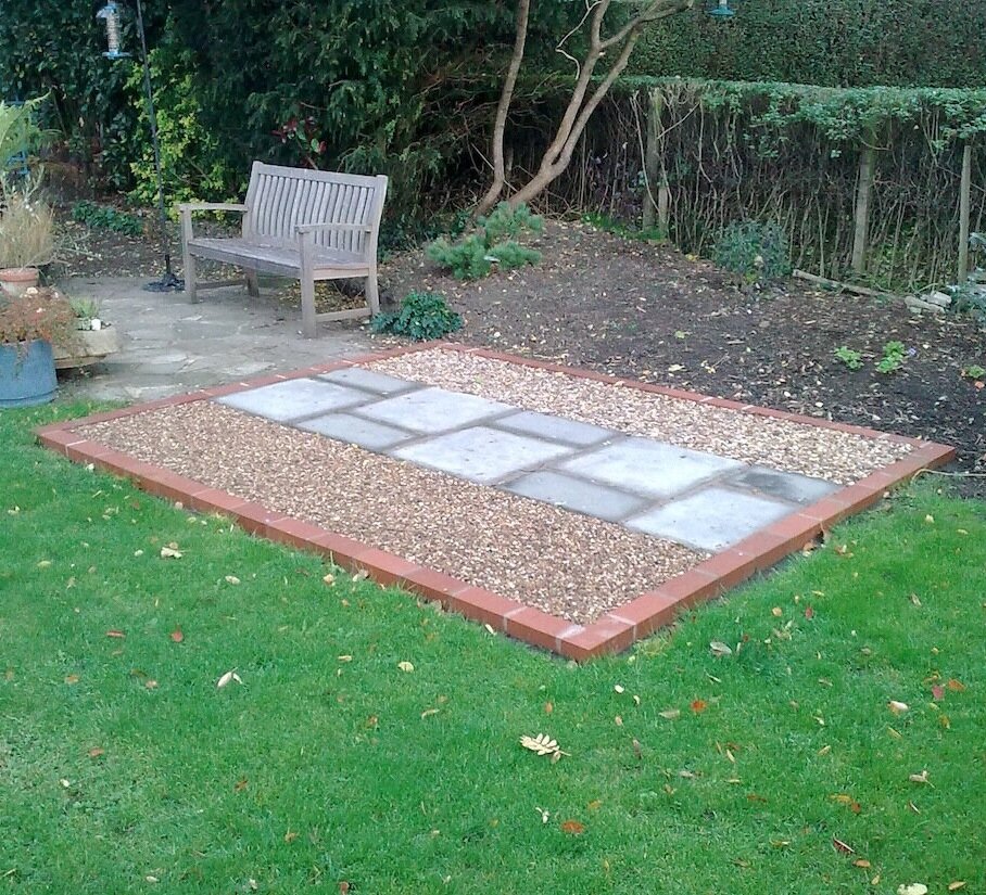 Brick base with sandstone paving and gravel