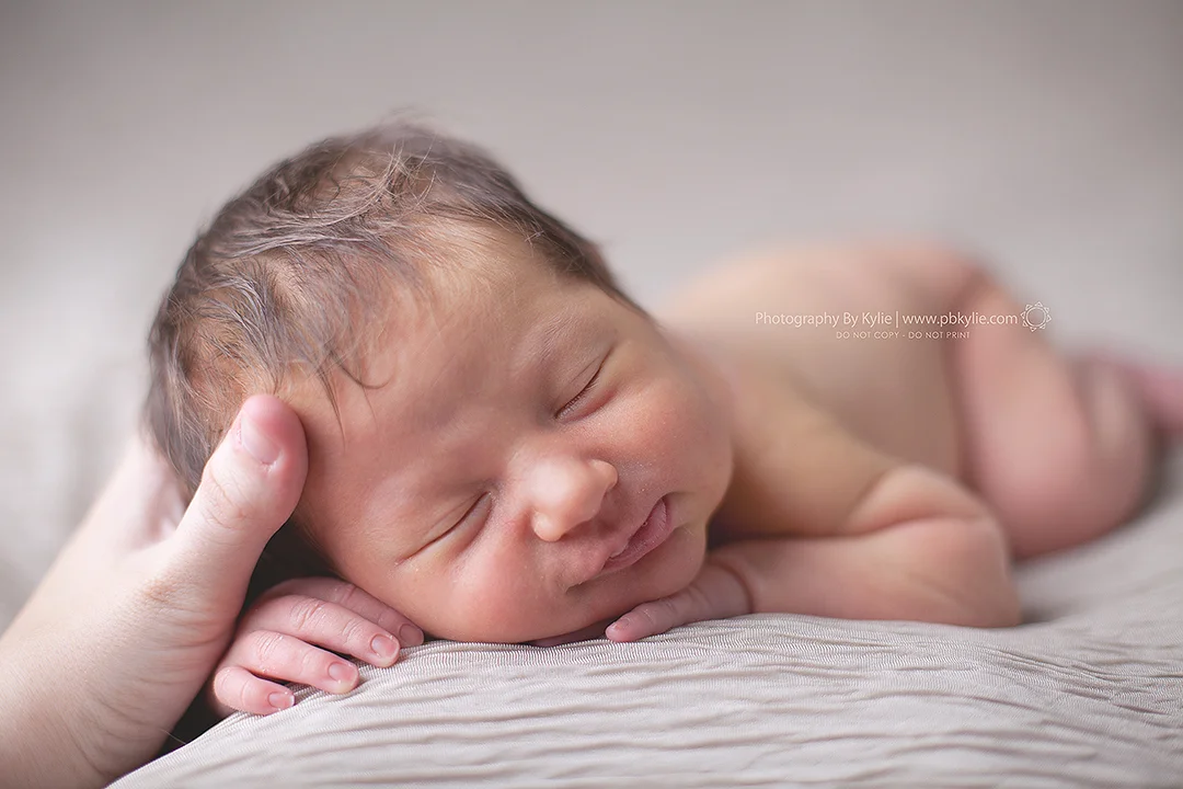 I had to leave my hand in this shot, as it's just so special being able to capture these beautiful children! I make a living off of soothing newborns to sleep and photographing them.... I'm not quite sure how I got that lucky, but I am so very blessed. Thank you for those sweet smiles and snuggles, Emily! Another miracle in the books.