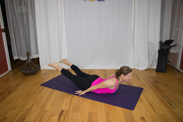 Strenghten Your Back with this Yoga Pose and say goodbye to lower back pain. Locust Pose variation. www.irenamiller.com