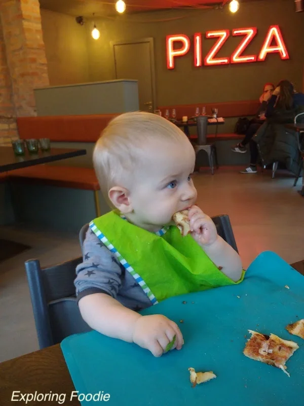 Baby R having its pizza at Gorms
