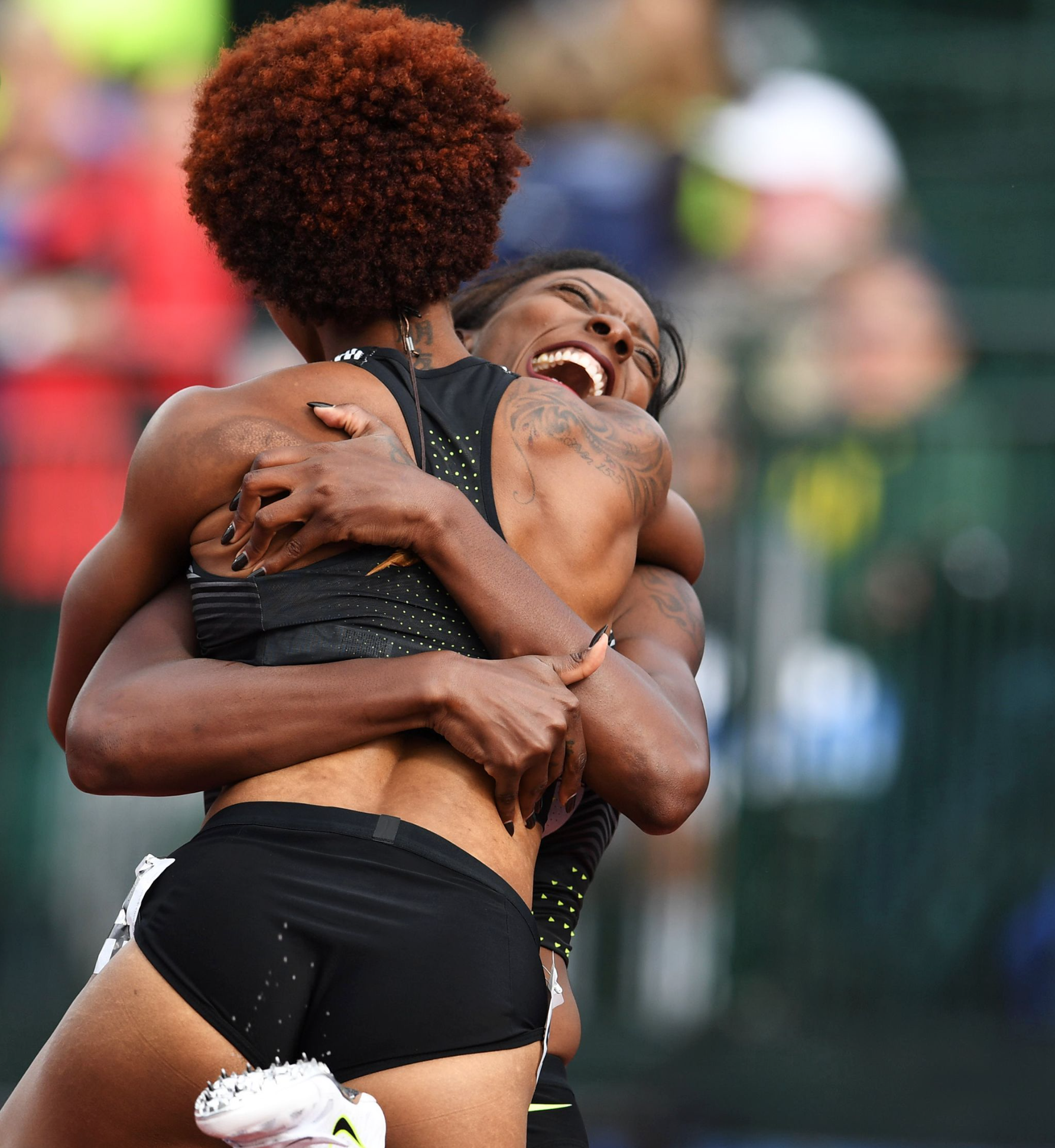 After both qualified for the Olympics in the women's 100-meter hurdles, Nia Ali and Brianna Rollins shared an embrace. 