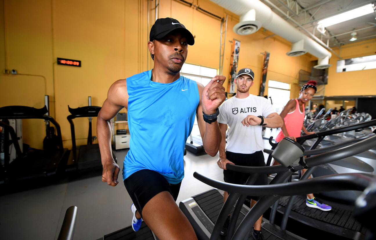 With Jason Hettler timing him and Olympian Muna Lee watching from the side, Merritt trains on a treadmill. Merritt always gives it his all, even when his kidney only could give him 10 percent.