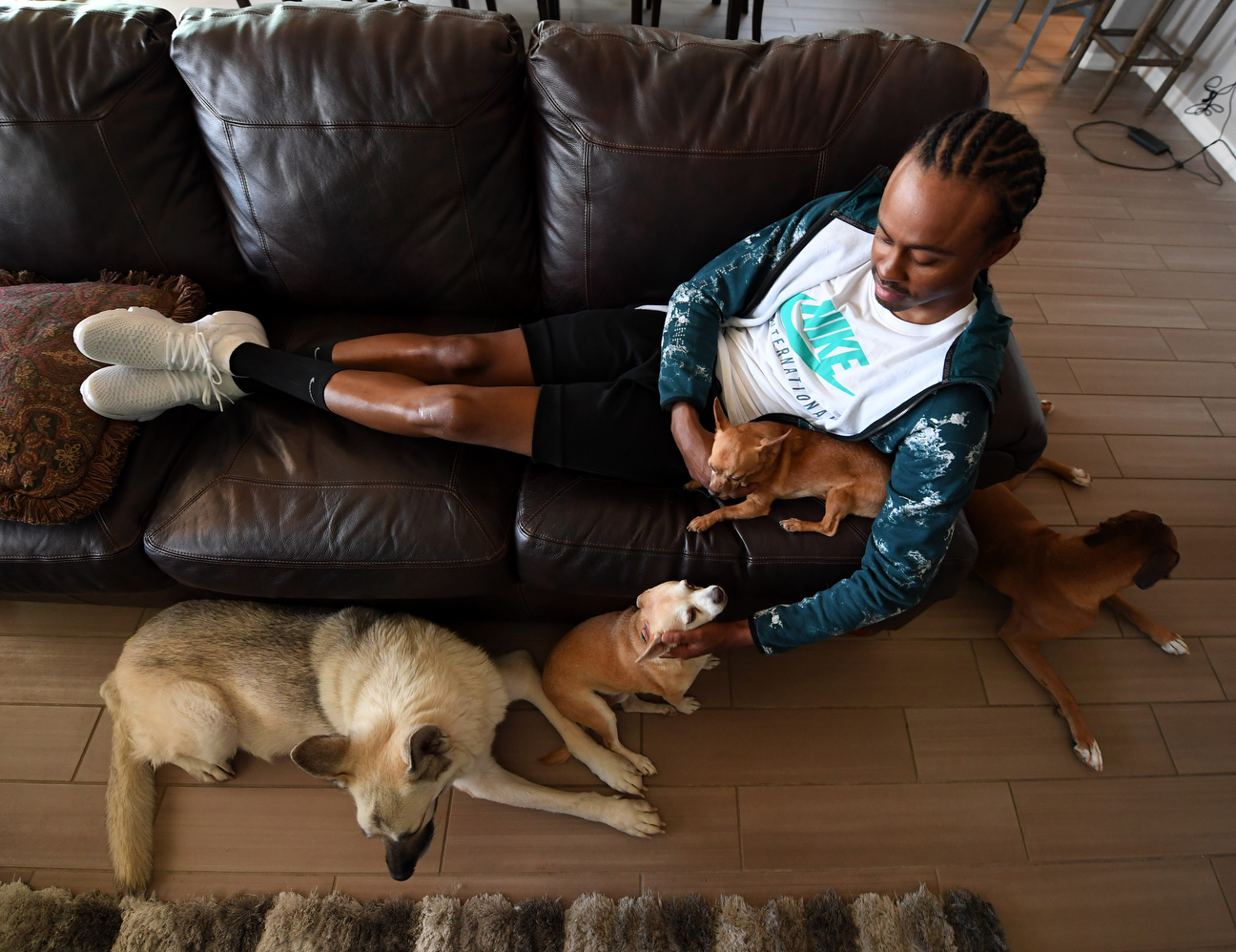 Here's one more demand required by the kidney transplant: Because of his immune system issues, Merritt can't clean up after his four dogs. He hired a helper for that dirty work.