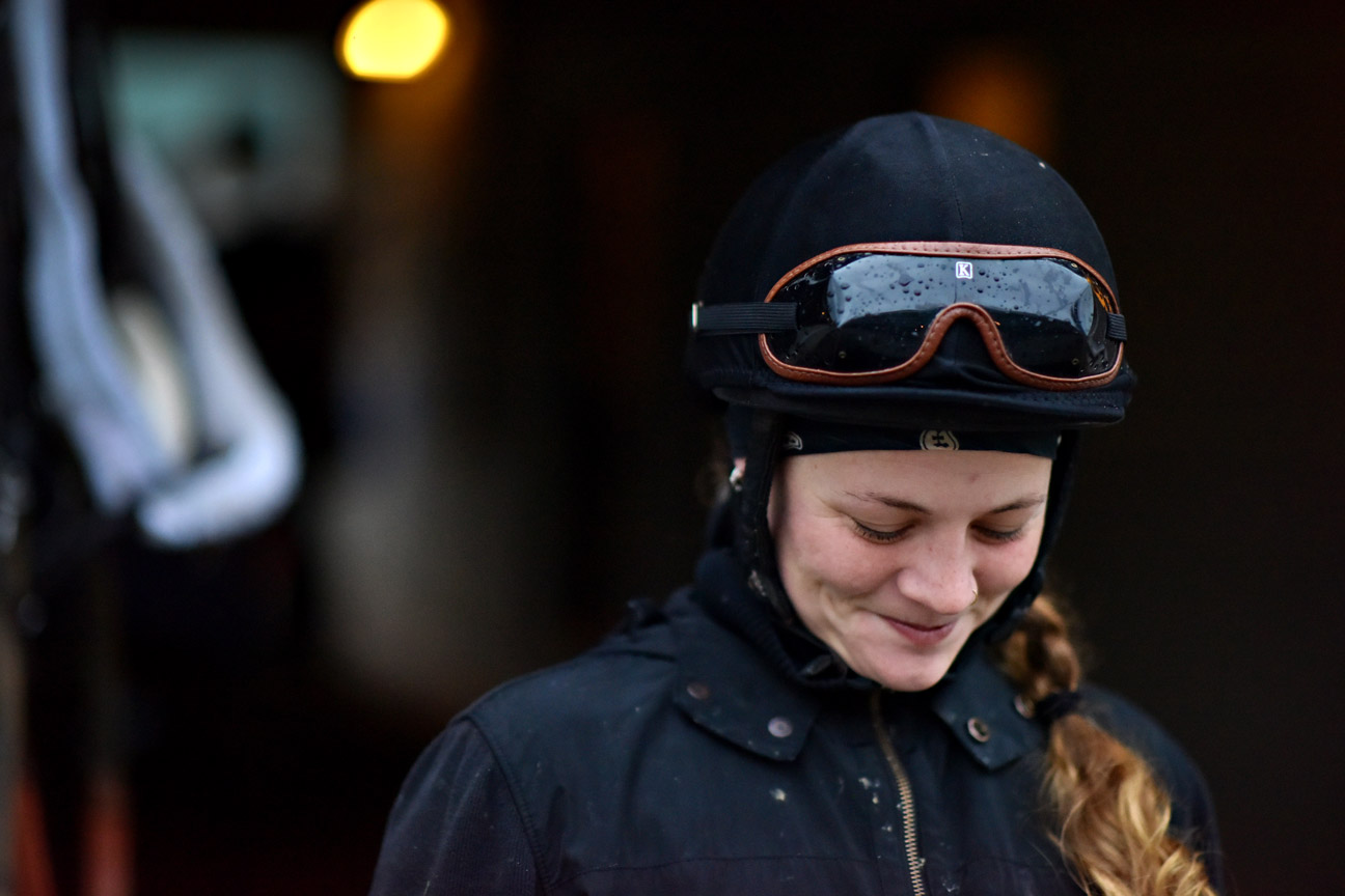 Exercise rider Hannah Sandwick stands outside the barns at Churchill Downs in the morning light. This is Sandwick's first Derby, and she loves galloping in the morning. Sandwick dropped out of Furman University in Greenville, South Carolina, where she was studying pre-med. Says Sandwick: "I haven't looked back since I started galloping five years ago."