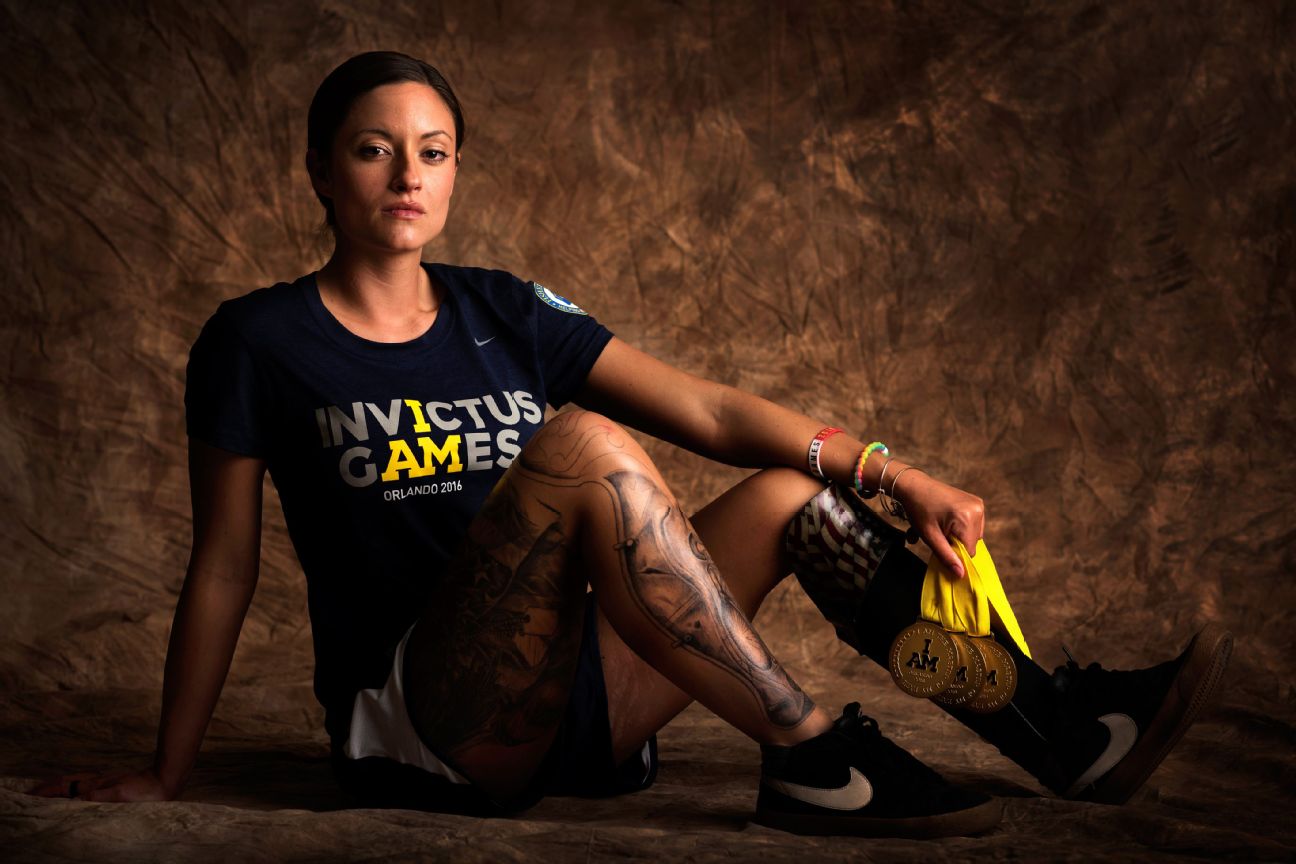 Elizabeth Marks, 25, served in the Army and is from Prescott Valley, Arizona. She returned one of the four gold medals she won to Invictus founder Prince Harry. "I gave it back to him to get it to Papworth Hospital because they saved my life."