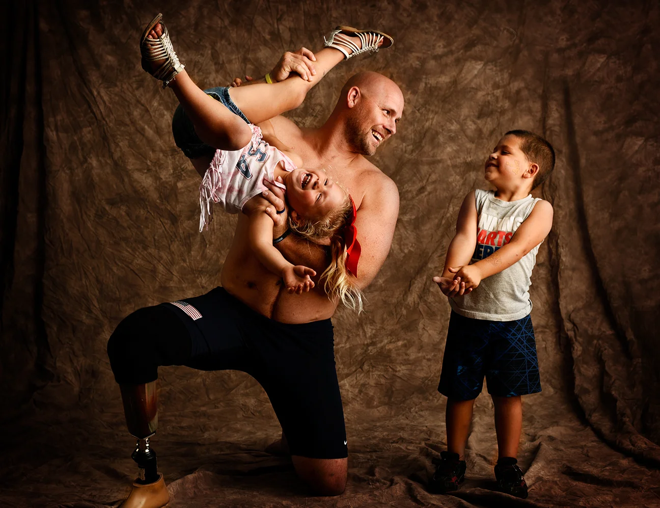 Brett Parks, 37, with his two children, Stella, 3, and Jason, 4, is from Miami and won a gold medal in volleyball and a silver on a swim relay team.