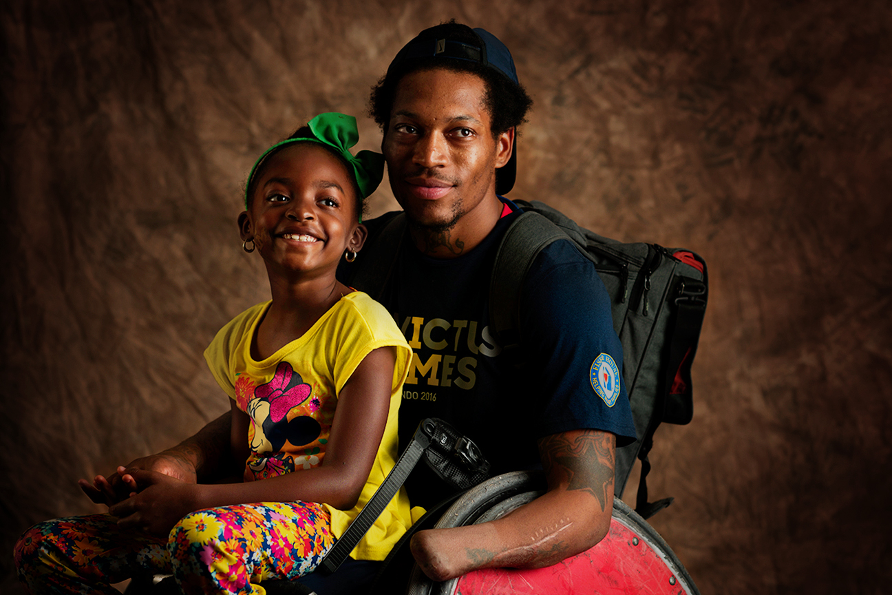 Anthony McDaniel, 27, and his daughter, Dejah, 7. McDaniel is a Marine Corps veteran originally from Pascagoula, Mississippi. He captained the gold medal-winning rugby team, won a gold medal in basketball and bronze in rowing and 100 meters.
