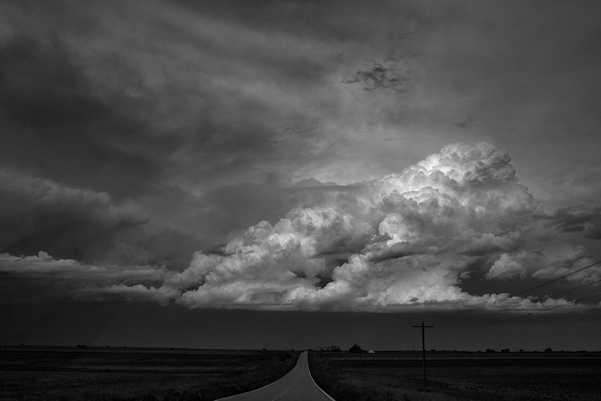 A summer storm blows across the open Nebraska landscape between Red Cloud and Hastings, NE.