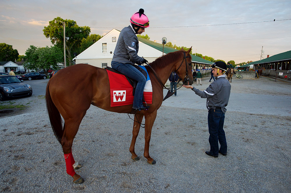 Hernandez feeds a stable pony some candy at the barns on Thursday at Churchill Downs. The Louisiana-born Hernandez is looking to continue a tradition of Derby-winning jockeys from that state, one that includes Calvin Borel, Kent Desormeaux and Eddie Delahoussaye.