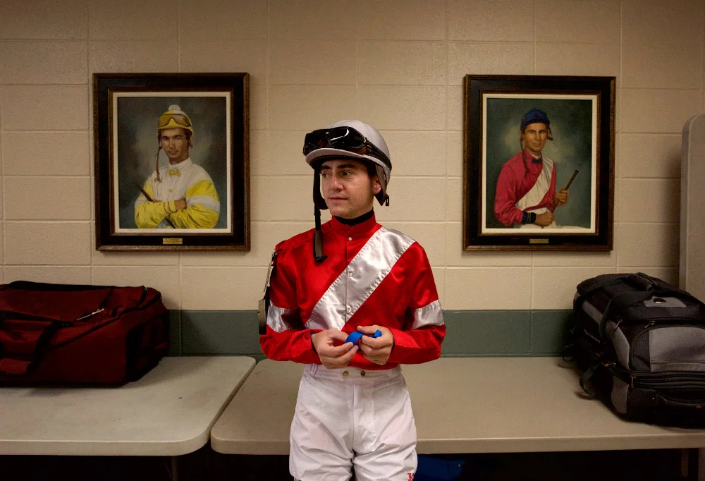 Hernandez stands before portraits of past Derby winners, including Bill Shoemaker (left) in the jockey lounge at Churchill Downs on Tuesday. The legendary Shoemaker, who died in 2003, was a four-time Derby winner.